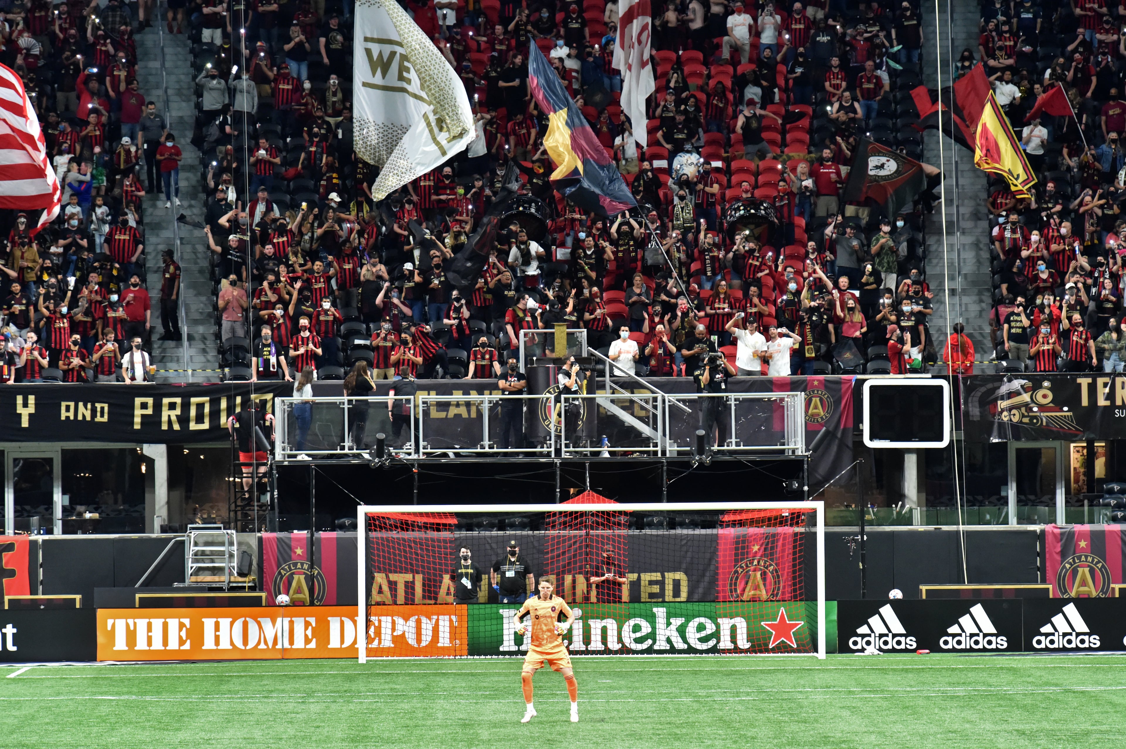 Atlanta United fans cheer during the second half in an MLS soccer match at Mercedes-Benz Stadium in Atlanta on Saturday, April 24, 2021. Atlanta United won 3-1 over Chicago Fire. (Hyosub Shin / Hyosub.Shin@ajc.com)