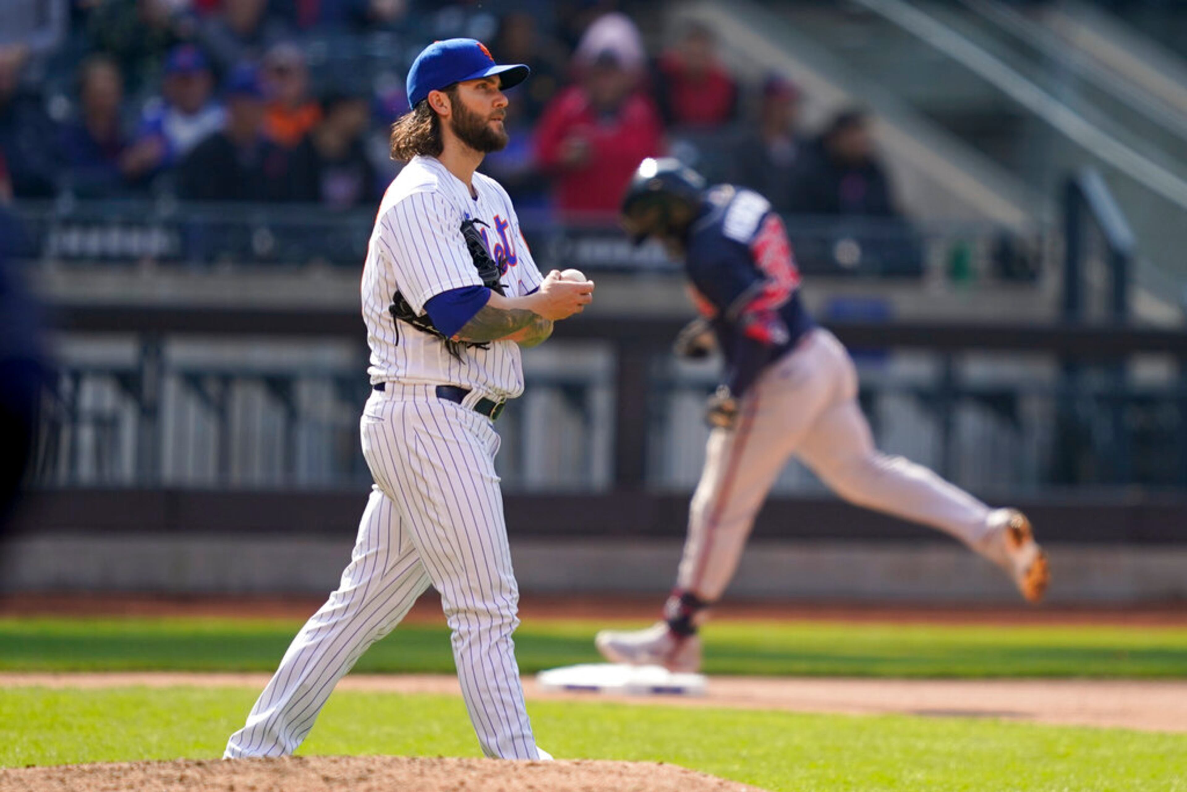 New York Mets starting pitcher Trevor Williams (29) walks up the mound after giving up a two-run home run to Atlanta Braves' Guillermo Heredia in the eighth inning of a baseball game, Wednesday, May 4, 2022, in New York. (AP Photo/John Minchillo)