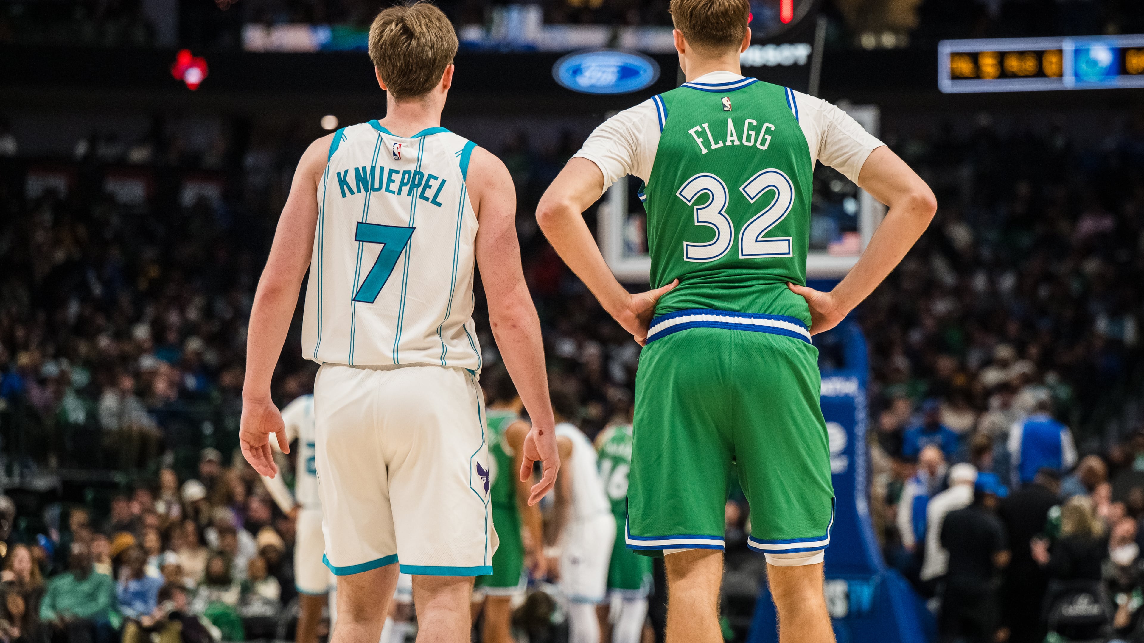 Charlotte Hornets guard Kon Knueppel (7) and Dallas Mavericks forward Cooper Flagg (32) wait for play to start during an NBA basketball game, Thursday, Jan. 29, 2026, in Dallas. (AP Photo/Jessica Tobias)
