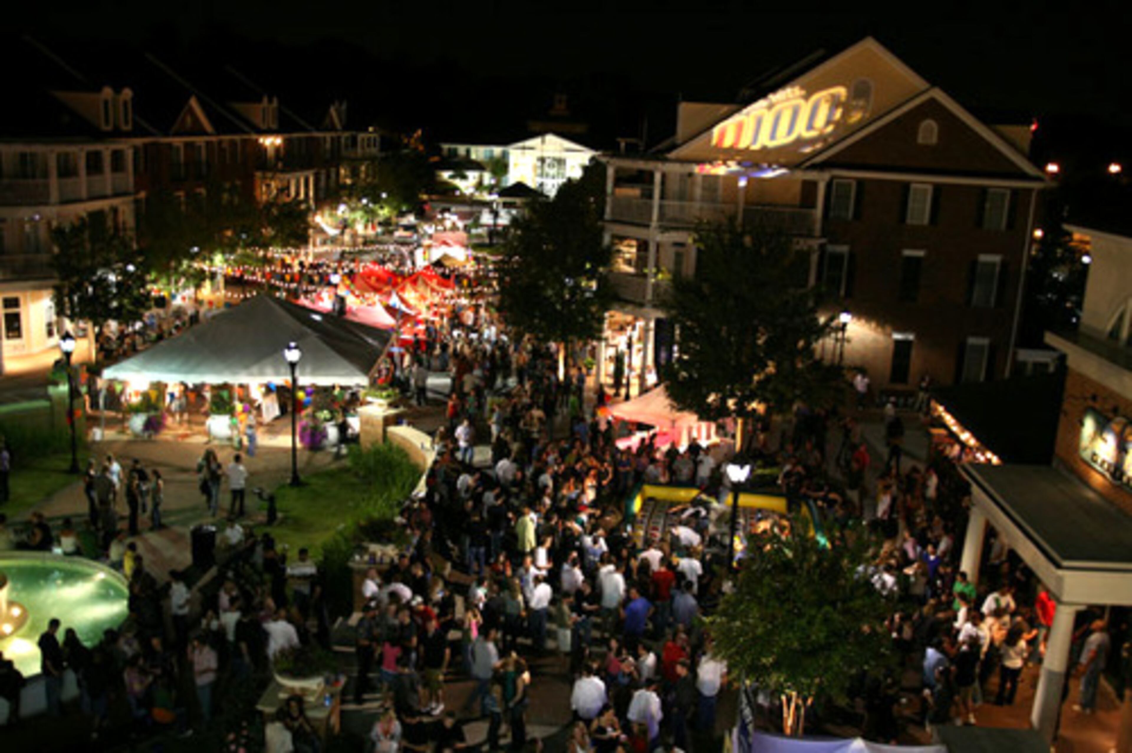 All The Hits Q100 threw its third annual Smyrnabration carnival party Saturday night at Smyrna's Market Village on Atlanta Road. Several thousand singles turned out for the festivities that included the Speed Dating Ferris Wheel, 100-foot Love Slide, an over-sized game of Twister and the popular Make Out Moonwalk.