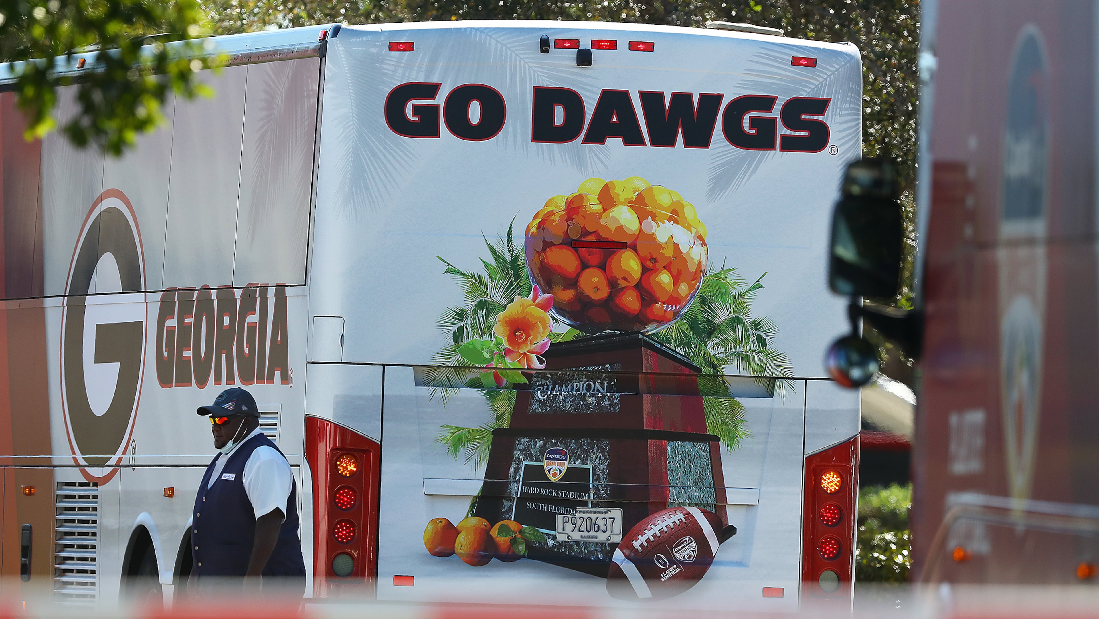 A bus driver appears to help block the view of Georgia team practice for the Orange Bowl with a team bus after arriving at Barry University on Monday, Dec 27, 2021, in Miami Shores. “Curtis Compton / Curtis.Compton@ajc.com”`