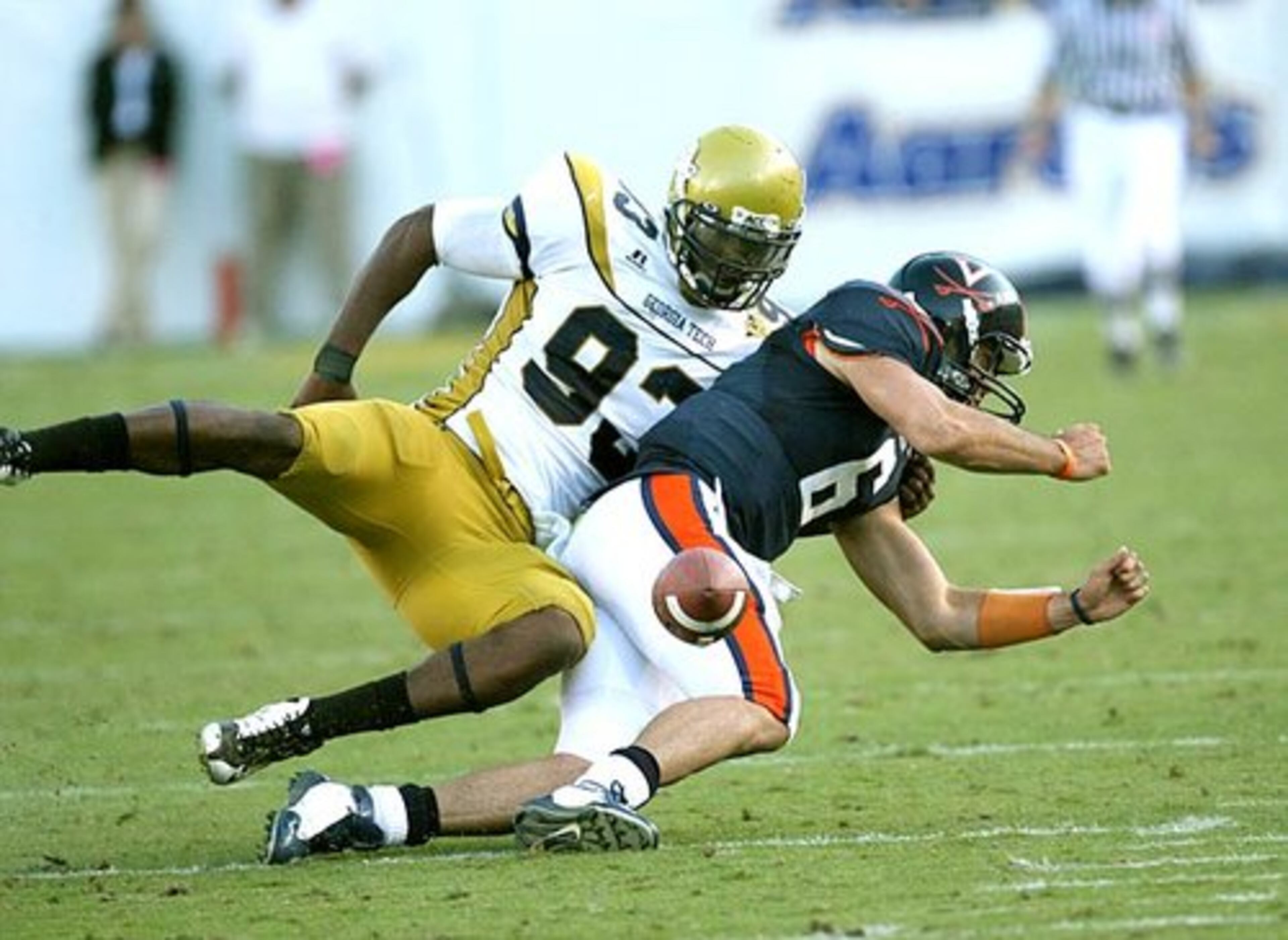 Georgia Tech's Michael Johnson sacks Virginia quarterback Marc Verica and strips the ball in the fourth quarter.