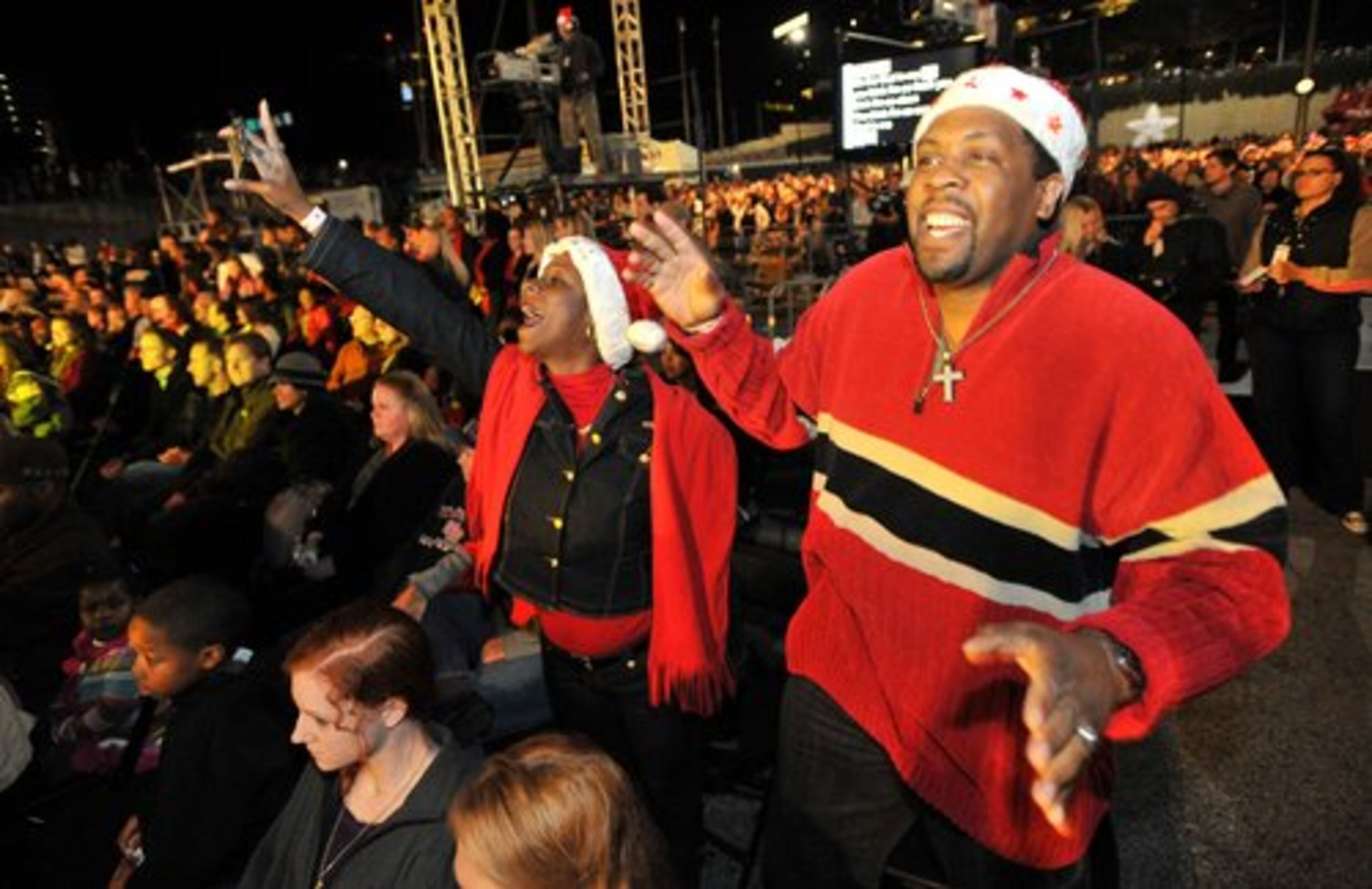 Jackie McKoy and her husband Bernard McKoy (right), of Douglassville, dance as they listen to live performance during the Macy's Great Tree Lighting Show at Lenox Square Mall on Thursday, November 24, 2011.
