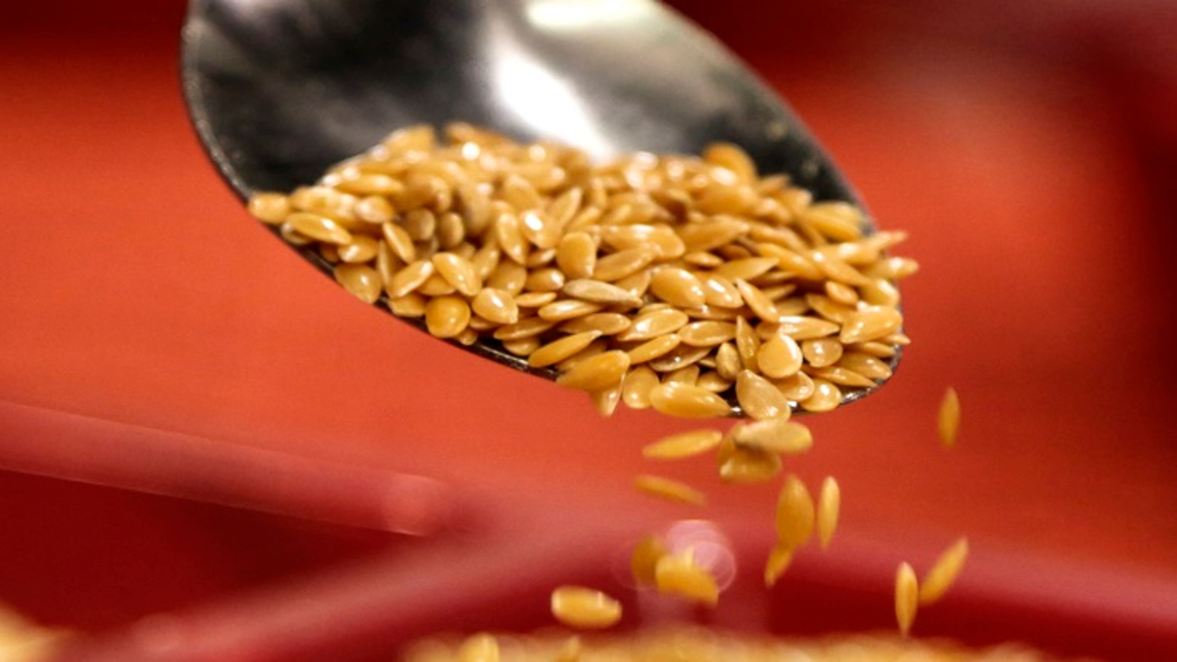 A spoon pours some gold flax at the Premium Gold Flax Products booth at the 2015 Natural Products Expo. (Mark Boster/Los Angeles Times/TNS)