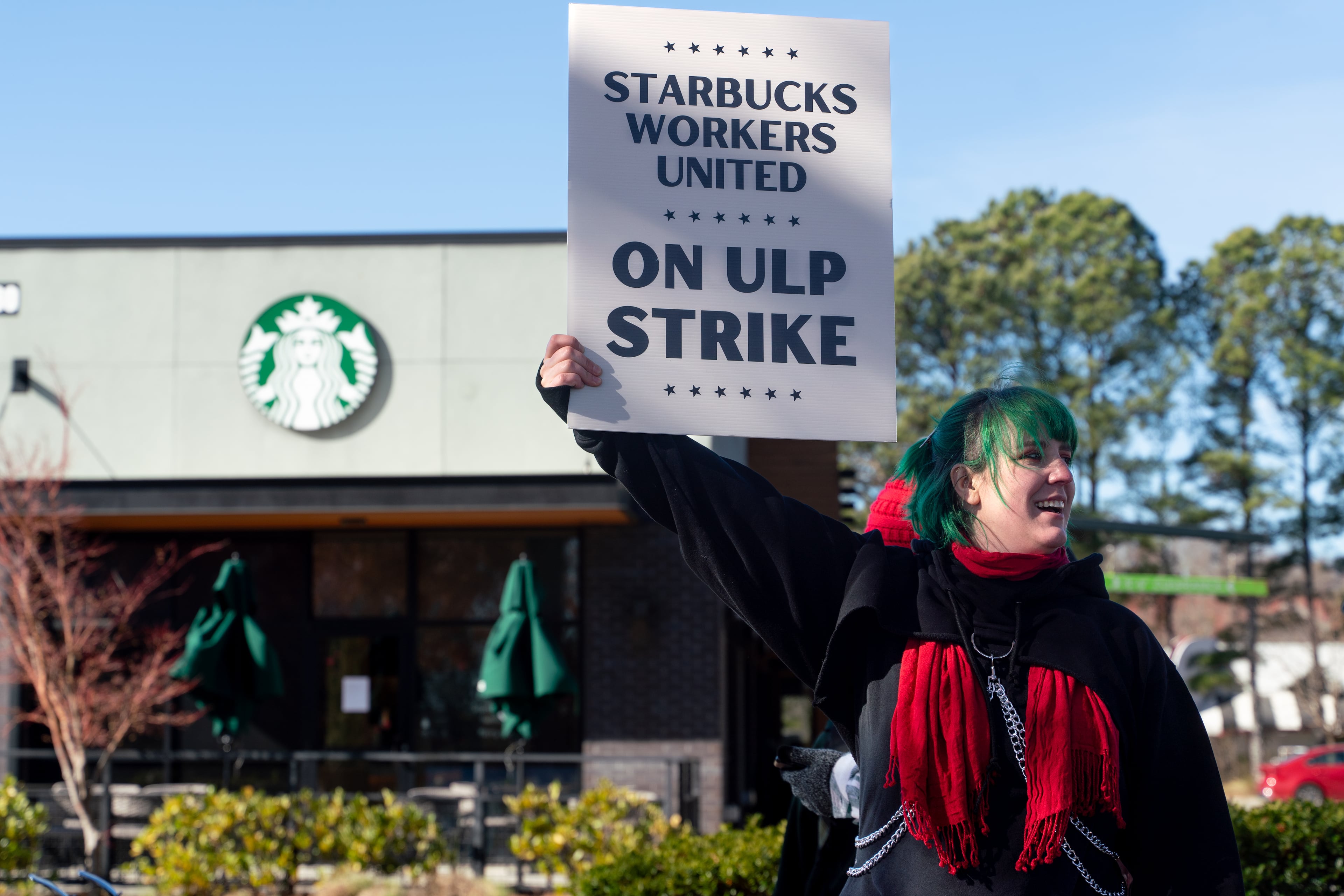 Cory Stepping protests outside the Starbucks on Haynes Bridge Road in Alpharetta in late 2024. Atlanta's City Council voted Monday to support a boycott of the popular coffee chain as union employees negotiate for more pay and better working conditions. (Ben Hendren for the AJC)