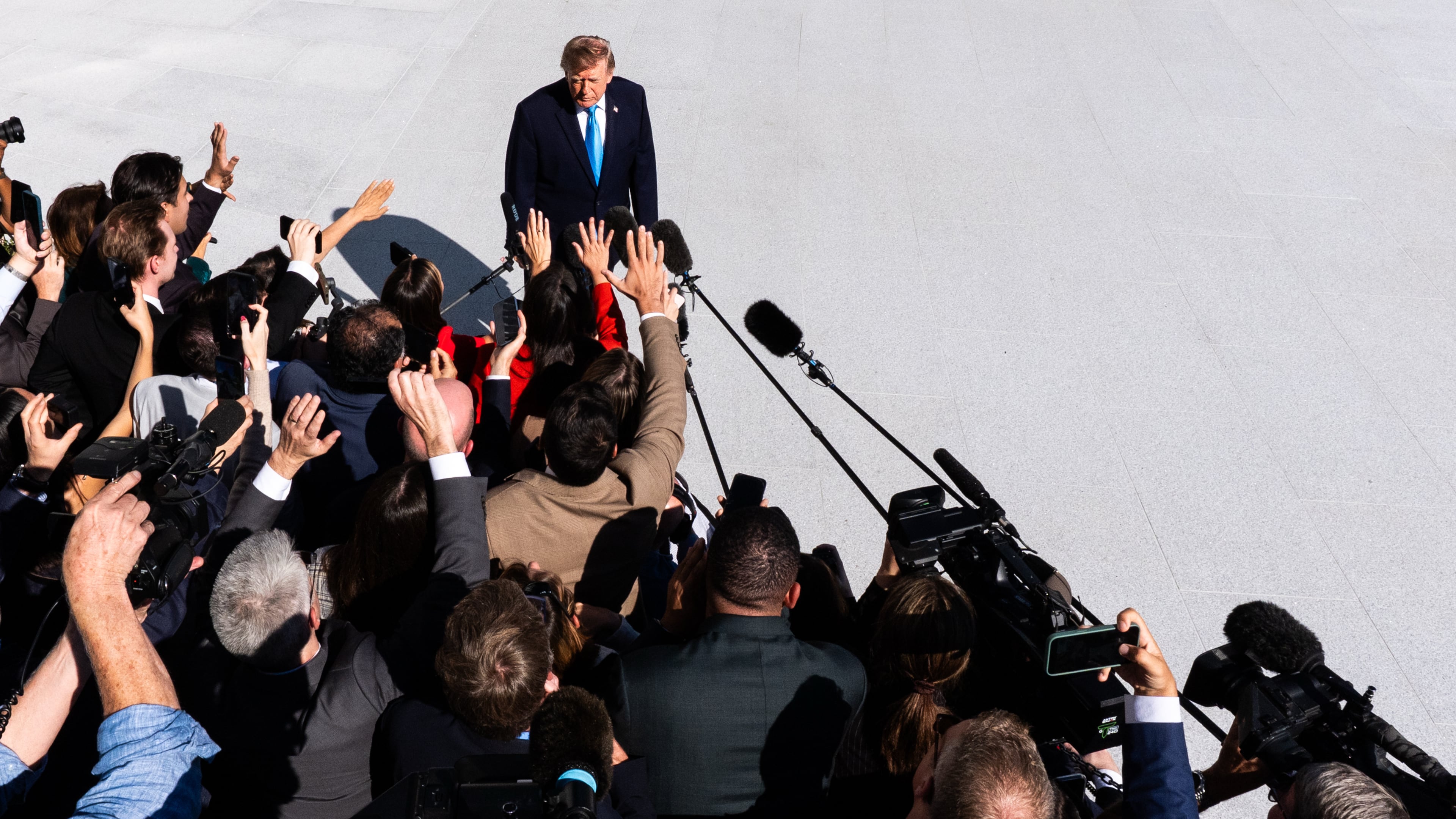 President Donald Trump talks with reporters before boarding Marine One on the South Lawn of the White House, Monday, Oct. 5, 2026, in Washington. (AP Photo/Julia Demaree Nikhinson)