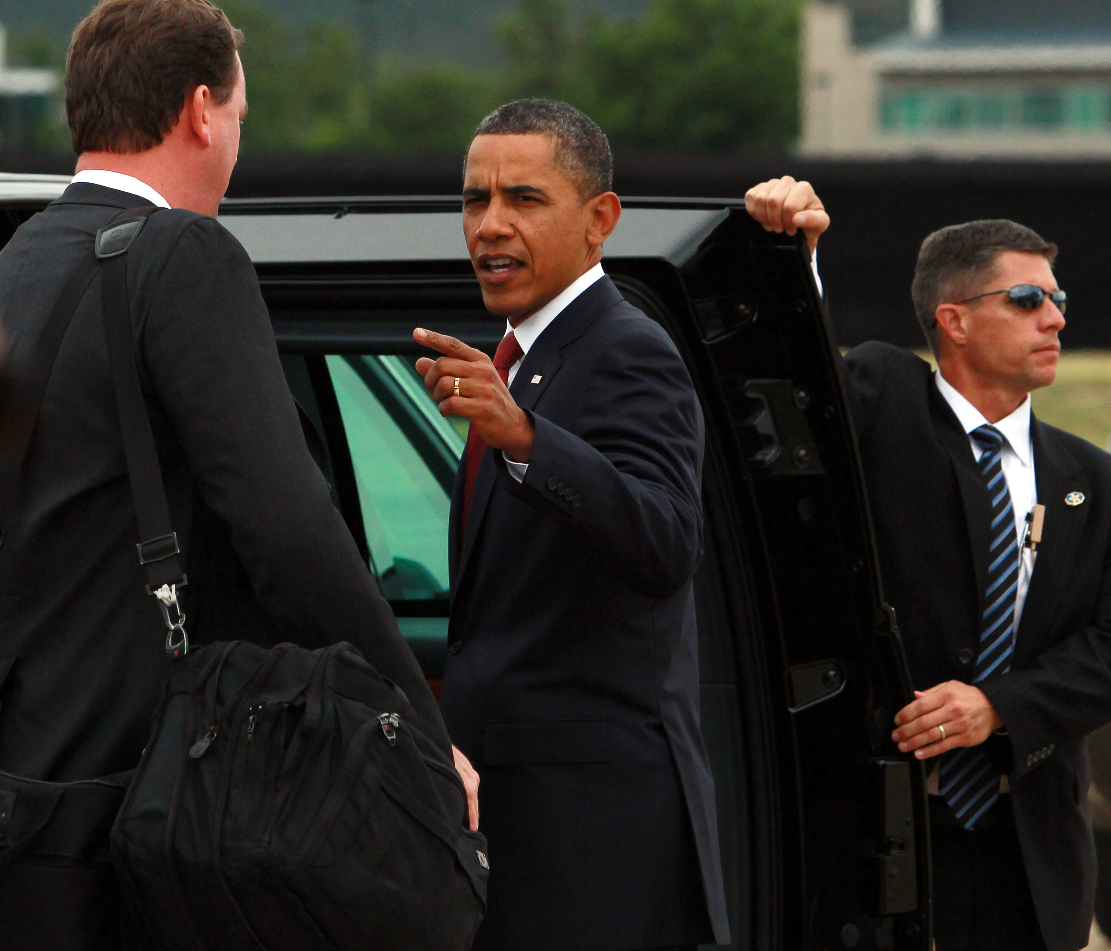 U.S. President Barack Obama prepares to enter the Presidential state car after arriving at Fairbairn Defence Establishment on the first day of his 2-day visit to Australia, on November 16, 2011 in Canberra, Australia. The President will today receive a Cermeonial Welcome, attend a bi-lateral meeting and hold a joint media conference with Julia Gillard, and attend a Parliamentary Dinner this evening, before addressing Parliament and heading to Darwin tomorrow. (Photo by Stuart McEvoy - Pool/Getty Images)