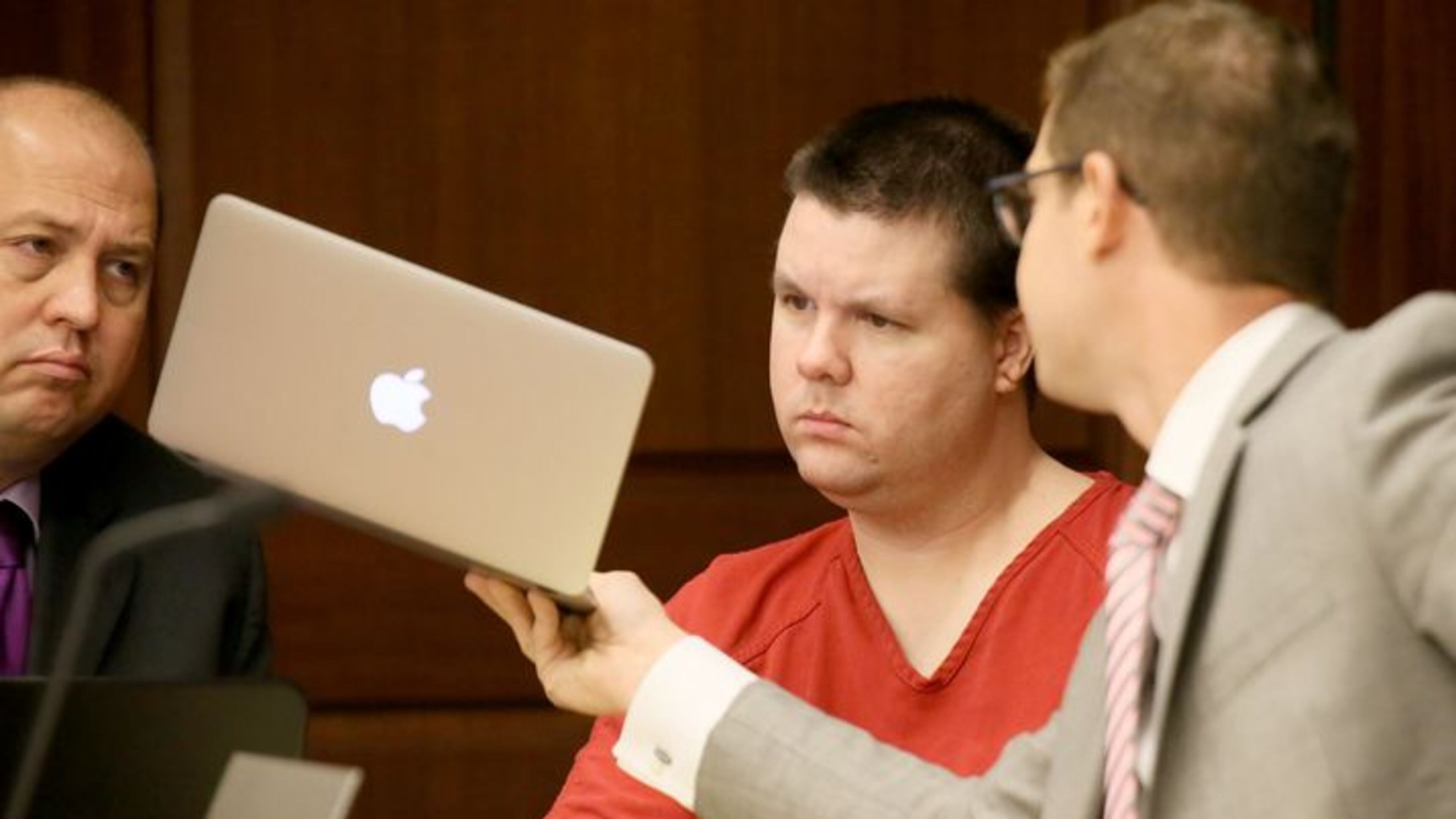 Justin Ross Harris confers with his attorneys during a recent motions hearing (File photo)