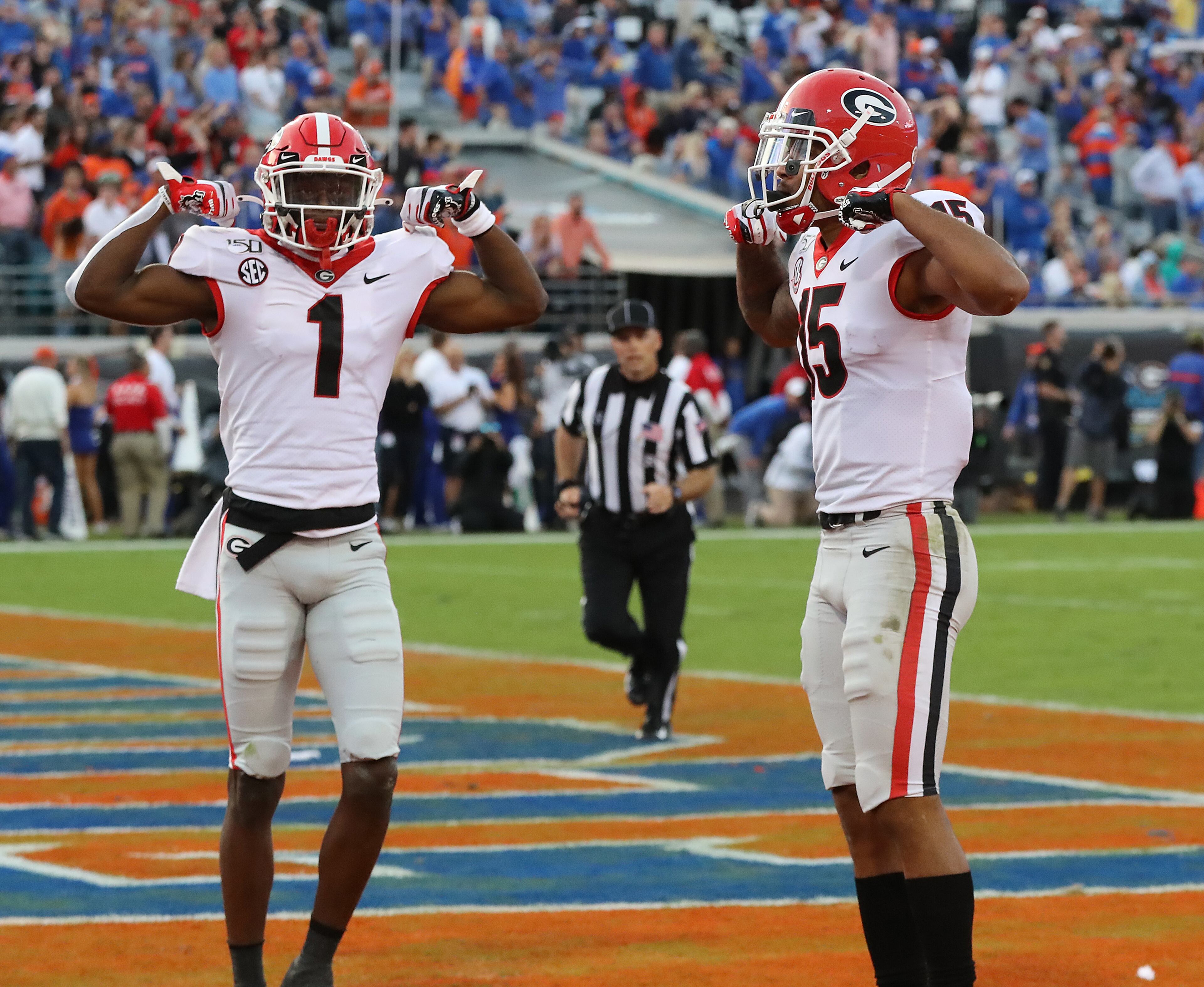 Georgia wide receivers Lawrence Cager (right) and teammate George Pickens flex. Curtis Compton/ccompton@ajc.com