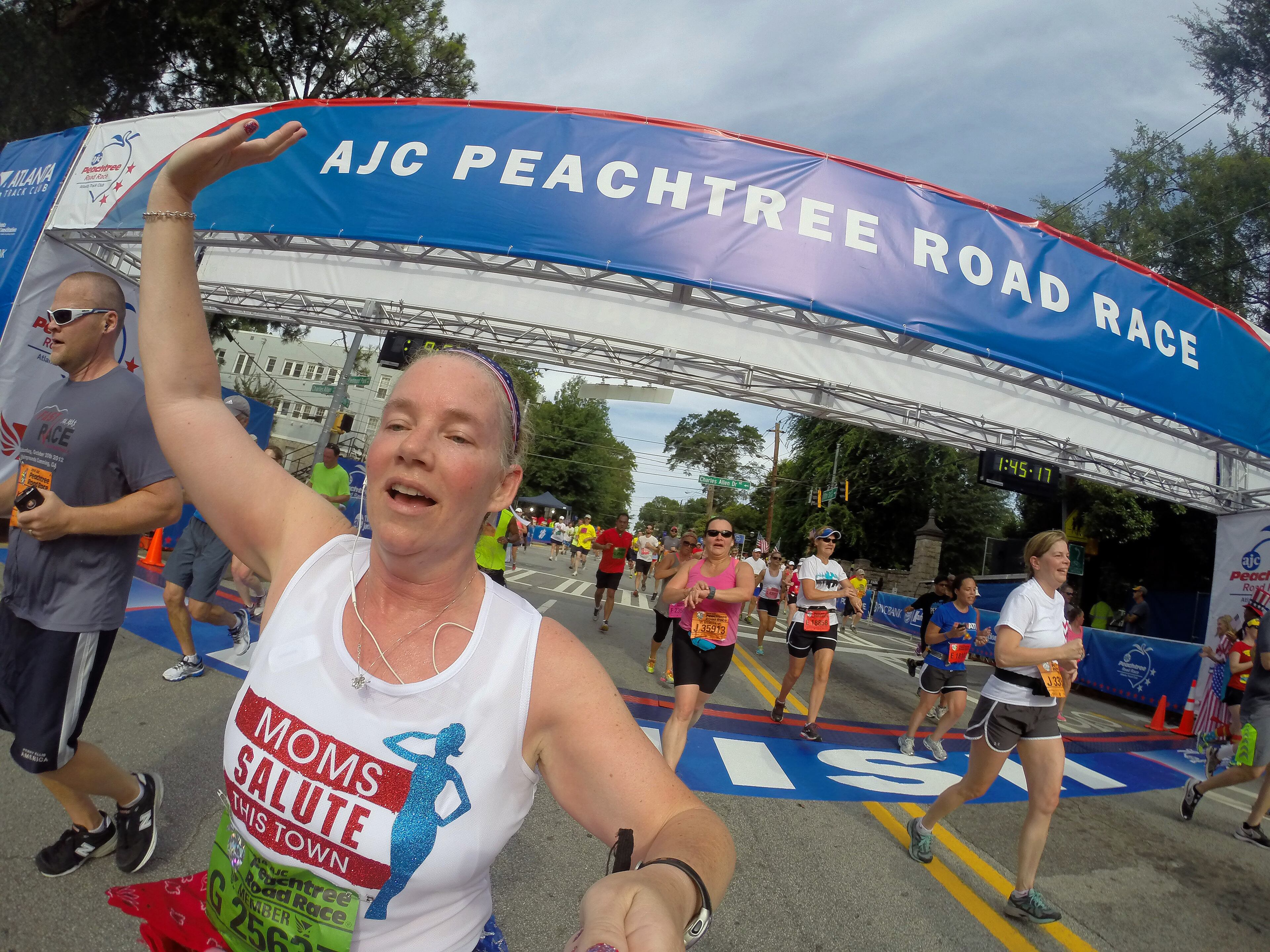 For most people, the AJC Peachtree Road Race is all about getting out and having fun with 60,000 other revelers. With that in mind, AJC Photojournalist Ben Gray passed a camera to runners as he made his way South on Friday morning July 4, 2014 and shot "selfies" of the runners as they carried the camera. BEN GRAY / BGRAY@AJC.COM