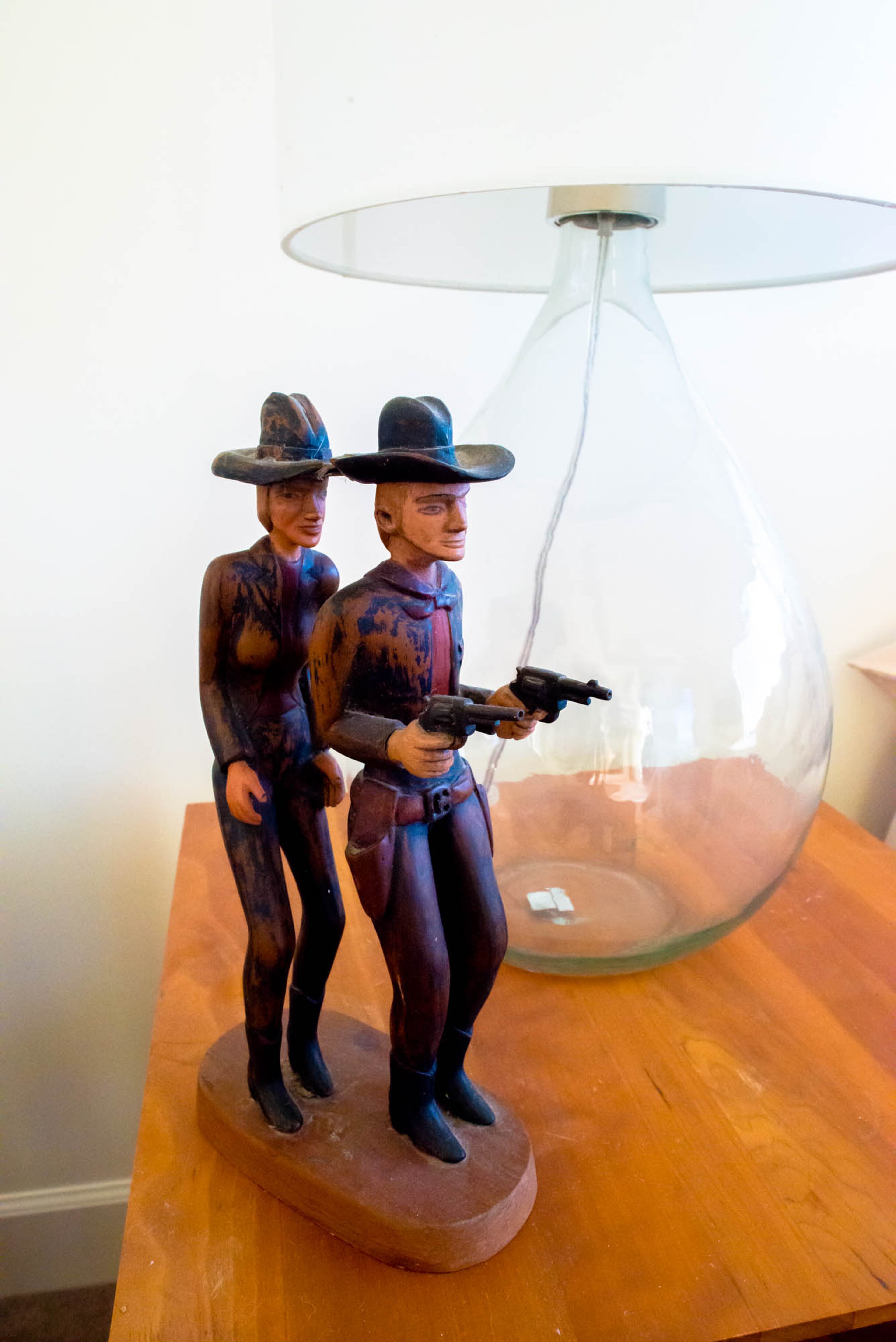 This piece was collected by the homeowners while doing their favorite activity: searching for folk art in the foothills of the North Georgia mountains. "When you see the guy with the gun you think 'oh he's defending his woman, he's going first'," said homeowner Pippa Seichrist. "But she looks very capable and aware. They're good partners." Text by Anna Logan/Fast Copy News Service.