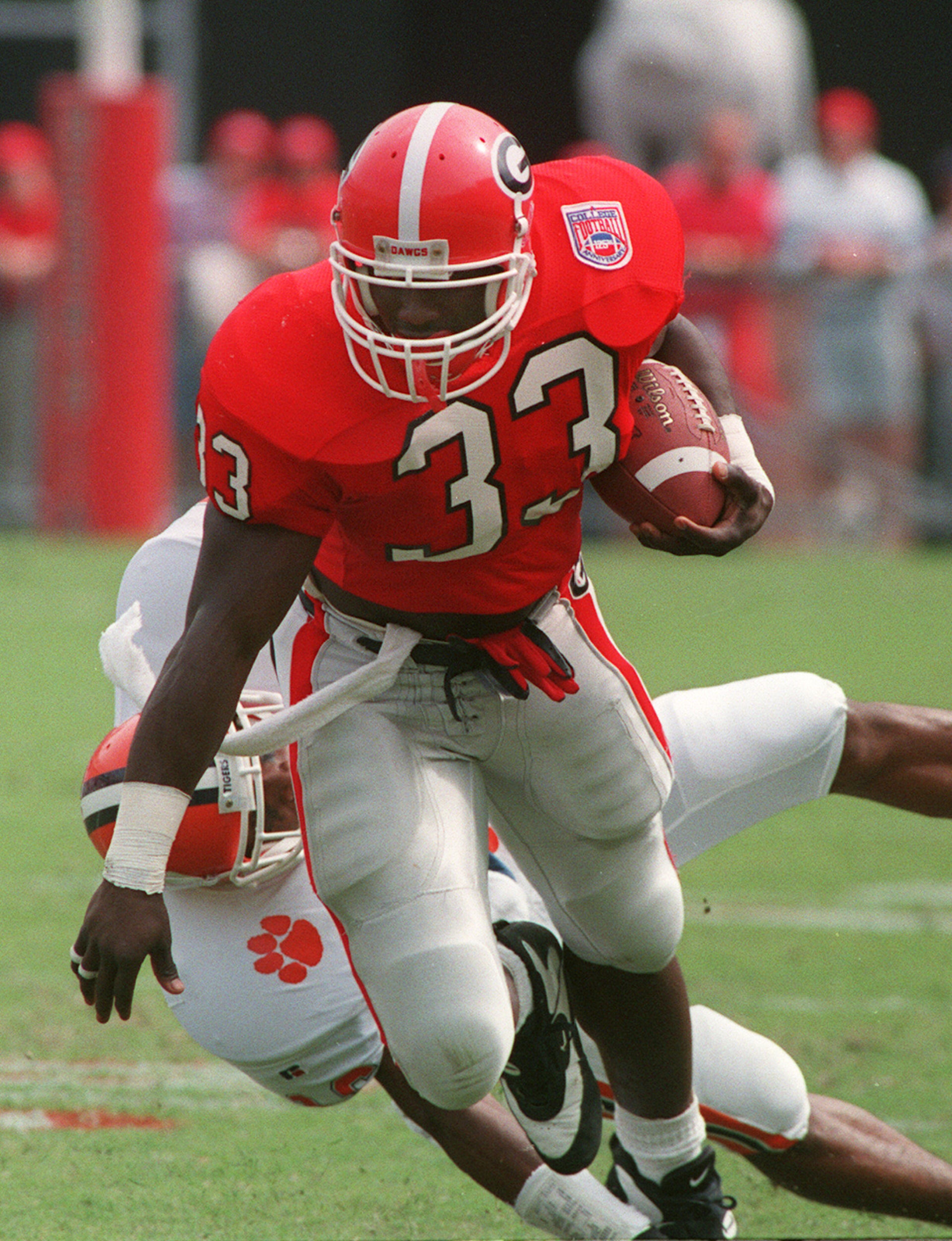 Georgia running back Terrell Davis carries the ball during a game against Clemson in 1994. (Curtis Compton/AJC Staff)