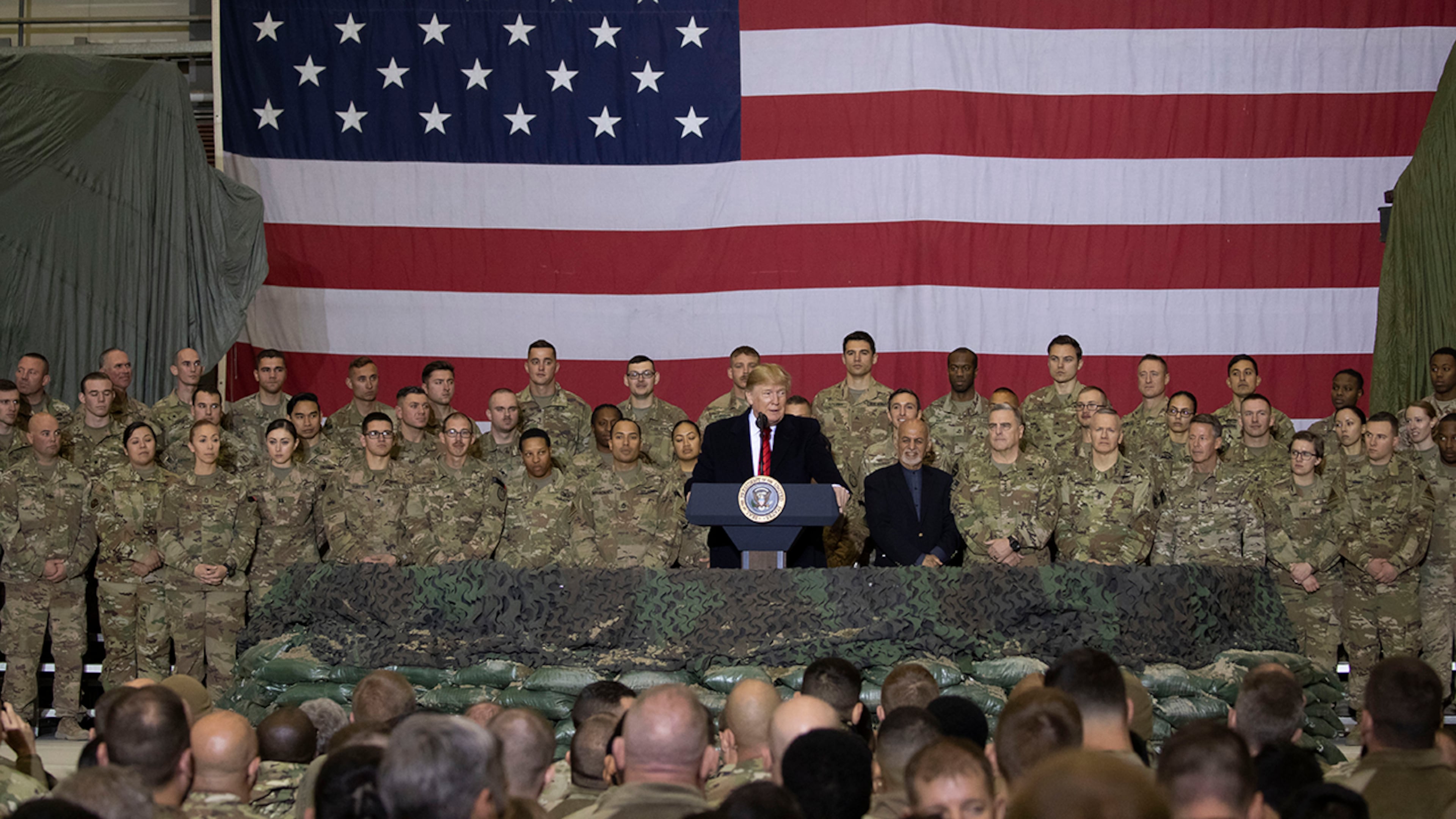 President Donald Trump addresses members of the military during a surprise Thanksgiving Day visit, Thursday, Nov. 28, 2019, at Bagram Air Field, Afghanistan. (AP Photo/Alex Brandon)