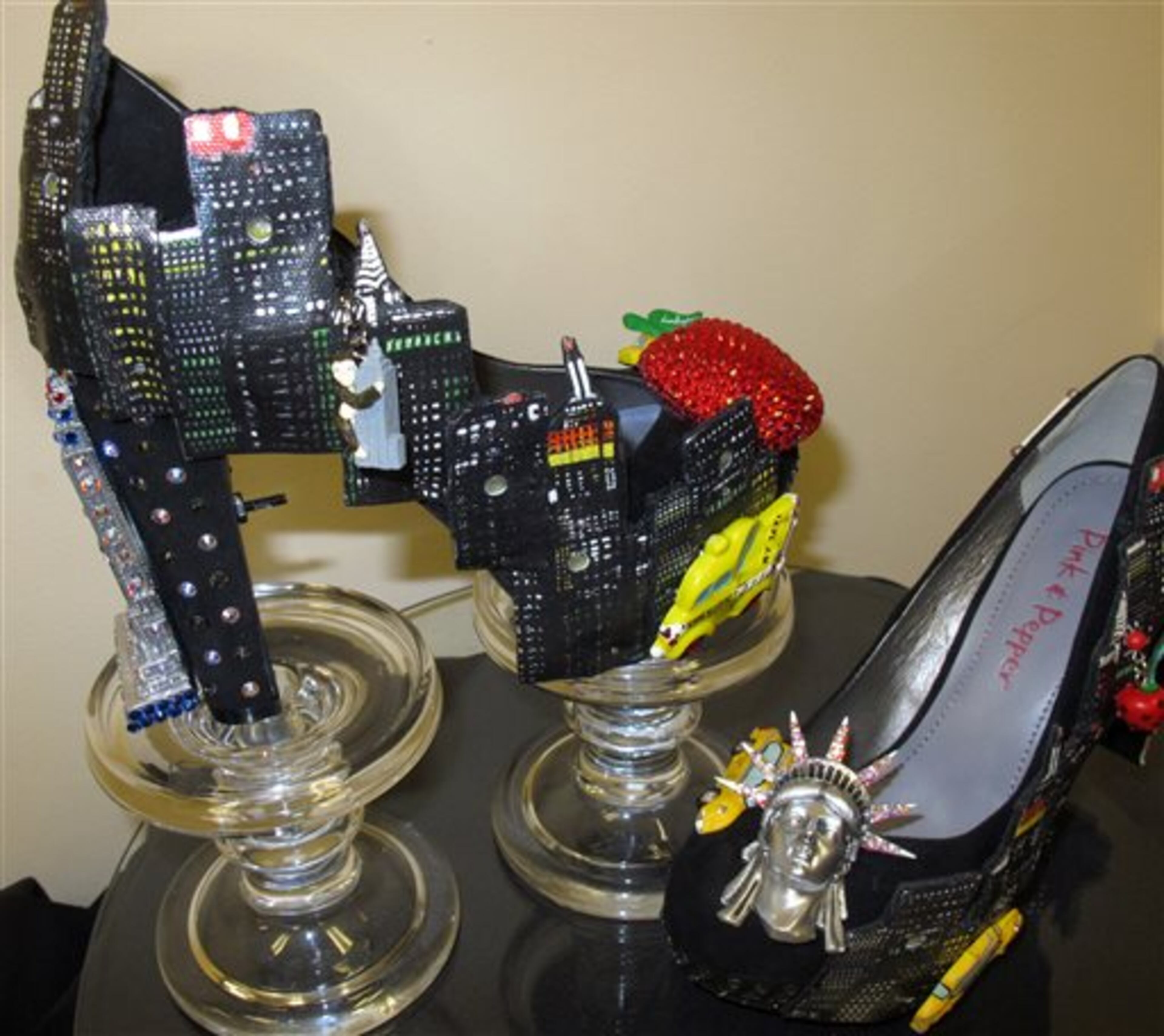 The shoes to be worn in the 2014 Miss America pageant's "show us your shoes" parade by Miss New York, are displayed during a new conference on Tuesday, Sept. 10, 2013, in Atlantic City N.J. The preliminary competitions began Tuesday, which is back in Atlantic City after a six-year absence. (AP Photo/Wayne Parry)