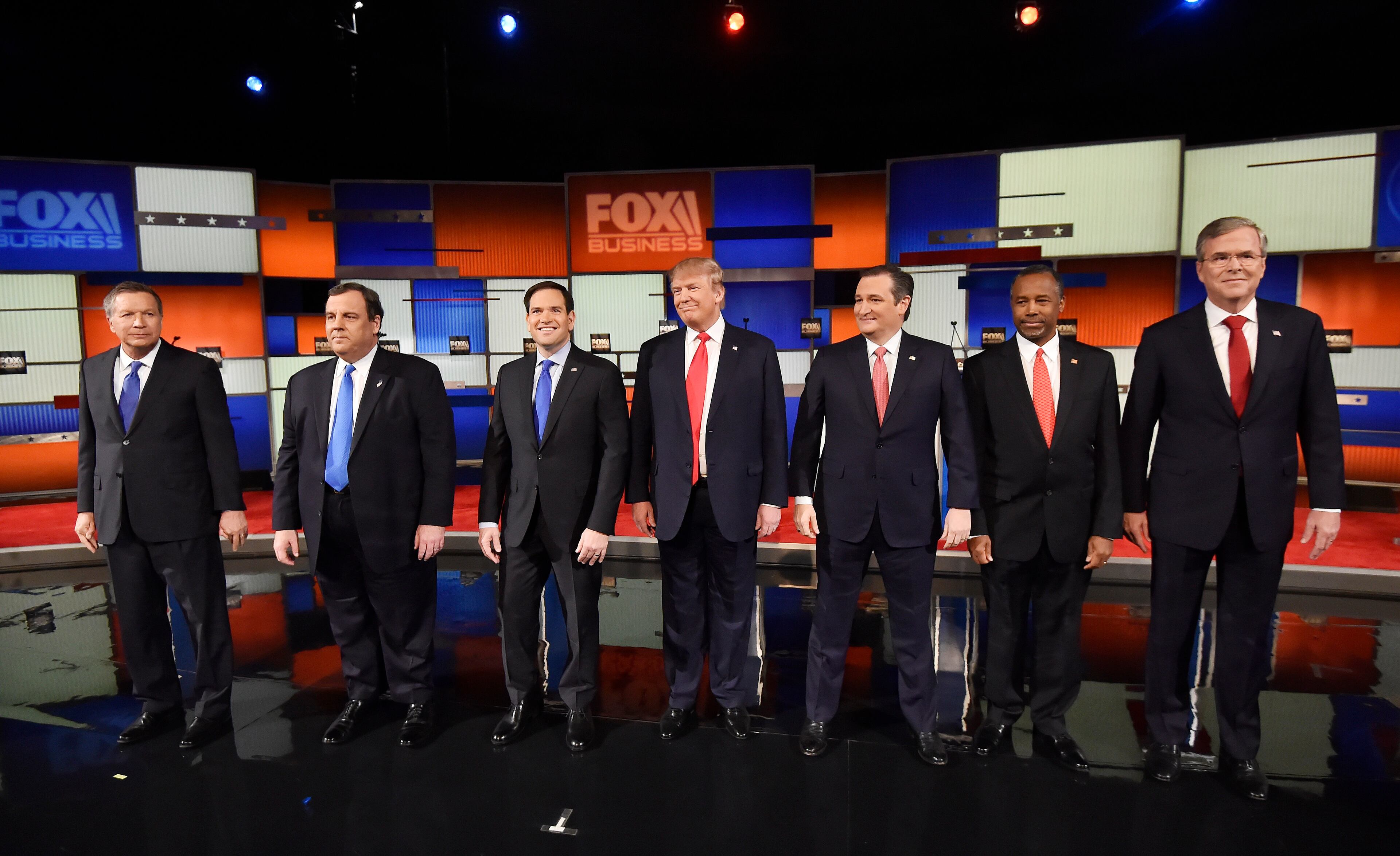 Republican presidential candidates, from left, Ohio Gov. John Kasich, New Jersey Gov. Chris Christie, Sen. Marco Rubio, R-Fla., businessman Donald Trump, Sen. Ted Cruz, R-Texas, retired neurosurgeon Ben Carson and former Florida Gov. Jeb Bush take the stage before the Fox Business Network Republican presidential debate at the North Charleston Coliseum, Thursday, Jan. 14, 2016, in North Charleston, S.C. (AP Photo/Rainier Ehrhardt)