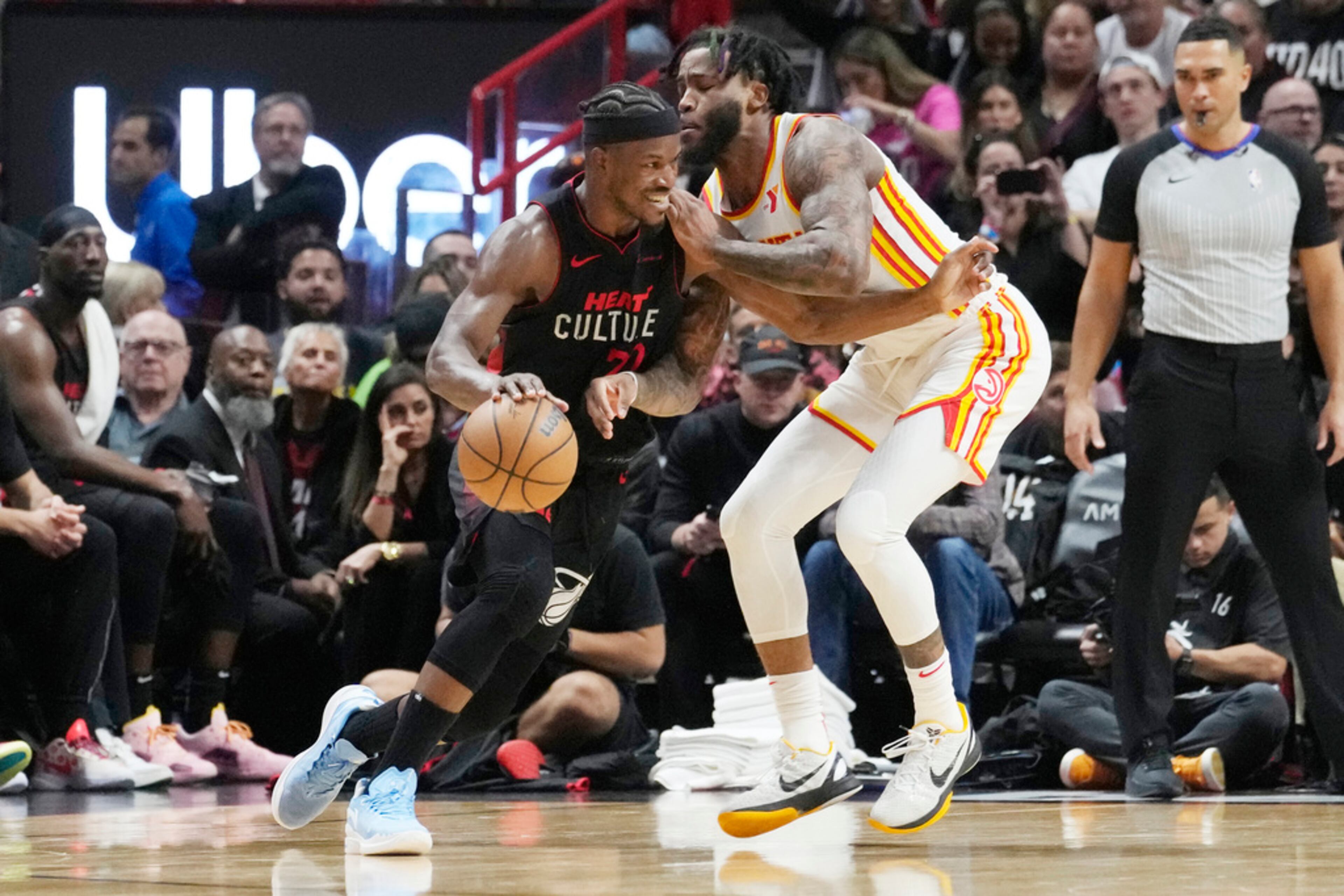 Atlanta Hawks forward Saddiq Bey (41) defends Miami Heat forward Jimmy Butler (22) during the first half of an NBA basketball game, Friday, Jan. 19, 2024, in Miami. (AP Photo/Marta Lavandier)