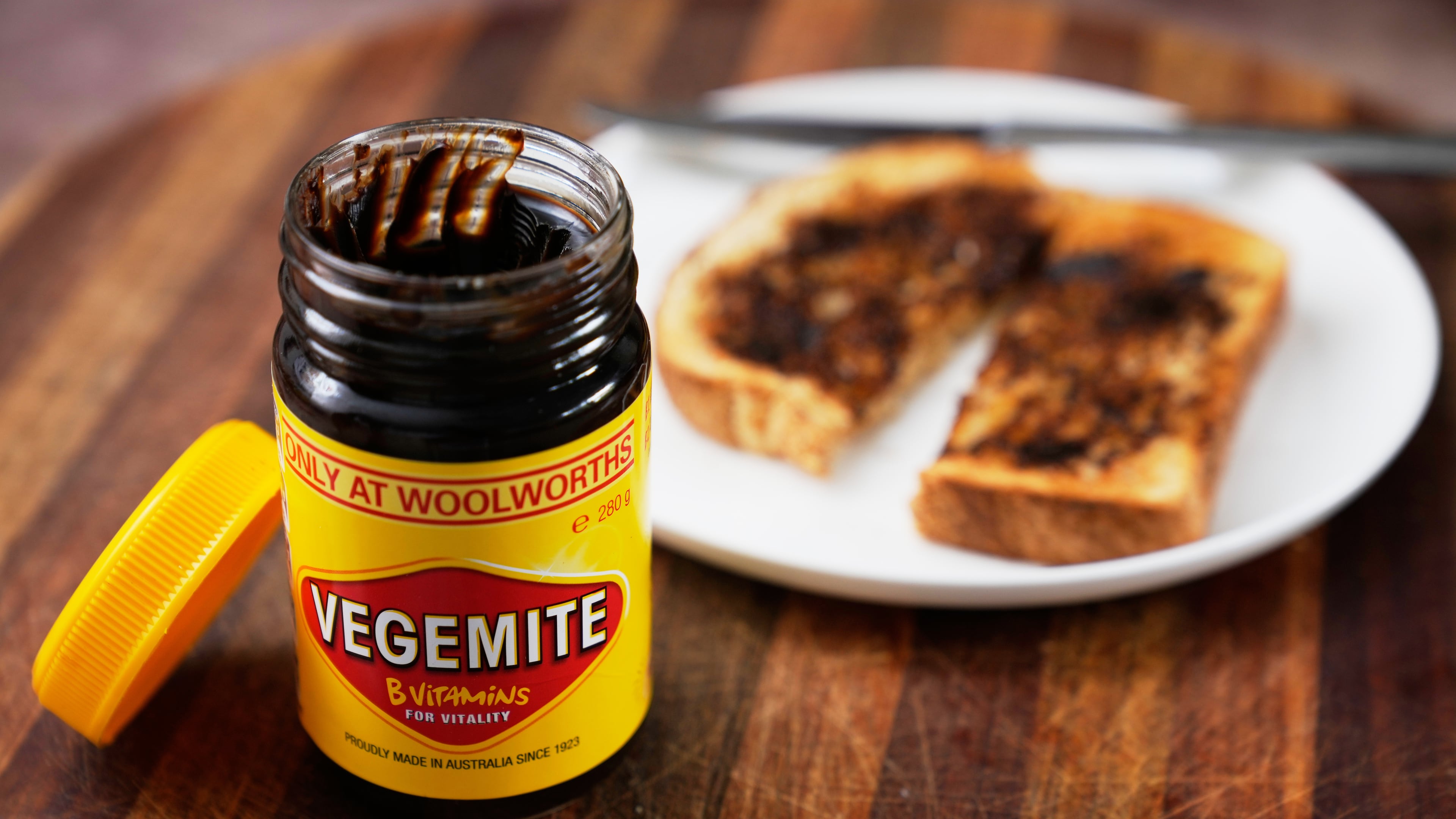FILE - A piece of toast is prepared with Vegemite in Sydney, Australia, Monday, Nov. 17, 2025. (AP Photo/Rick Rycroft, file)