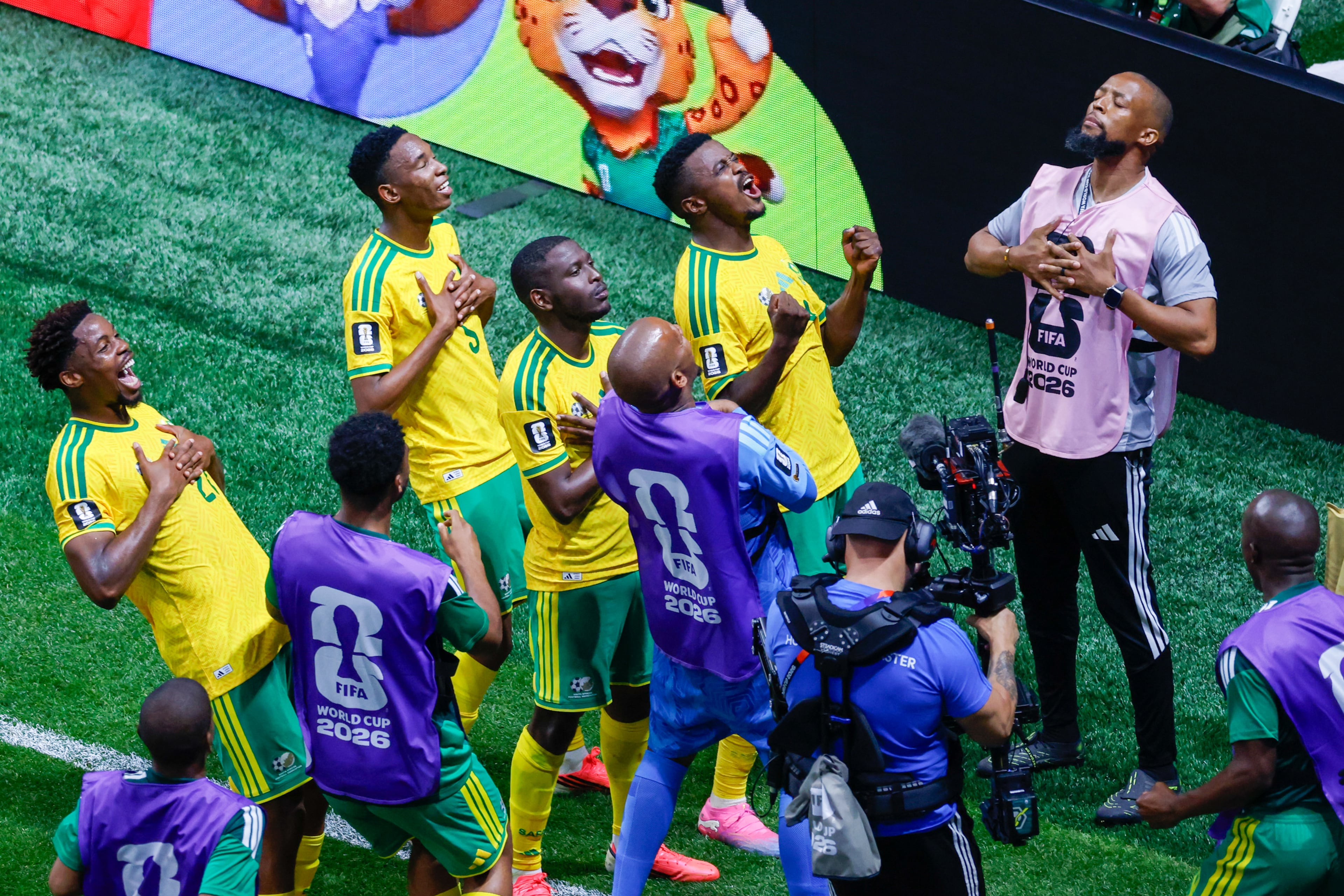 South Africa midfielder Teboho Mokoena (center, with fists raised) and teammates celebrate after Mokoena scored on a penalty kick in the second half of the Czechia vs. South Africa World Cup match at Atlanta Stadium on Thursday, June 18, 2026. (Arvin Temkar/AJC)