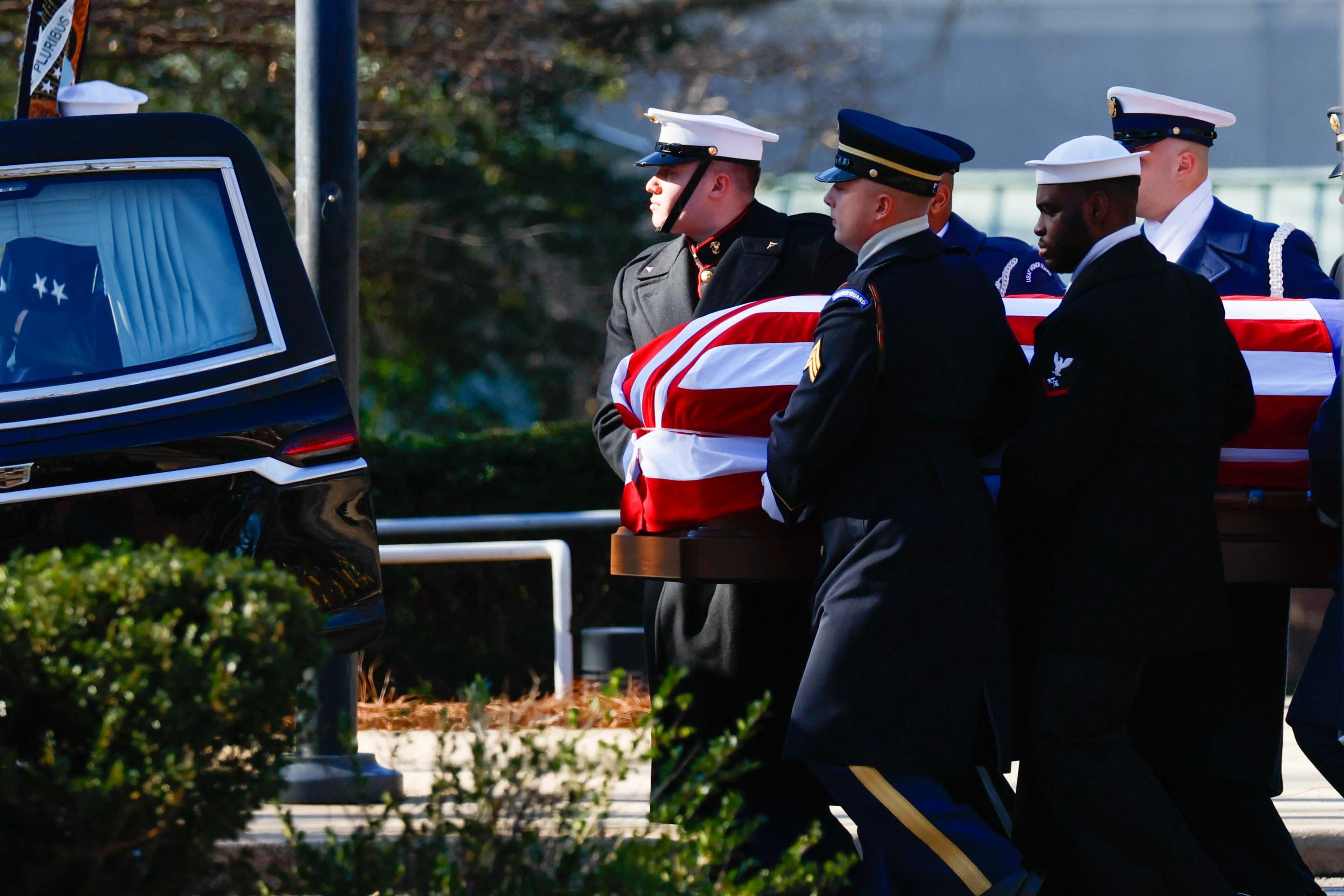 The Armed Forces Body Bearer team carries the casket of President Jimmy Carter to his hearse during his departure ceremony from Carter Presidential Center in Atlanta on Tuesday, January 7, 2025.
(Miguel Martinez/AJC)