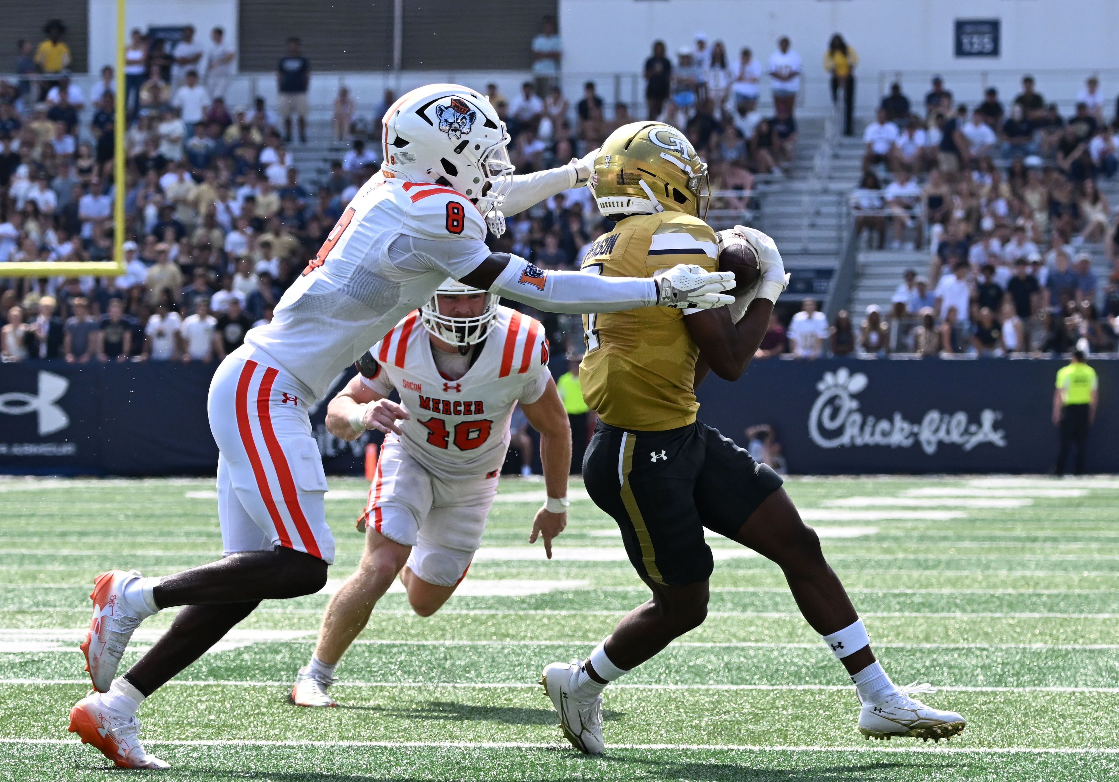 Georgia Tech wide receiver Dalen Penson (7) makes a catch over Mercer cornerback Cameron Goggins (8) during the first half in an NCAA college football game at Bobby Dodd Stadium on Saturday, Sept. 19, 2026, in Atlanta. (Hyosub Shin/AJC)
