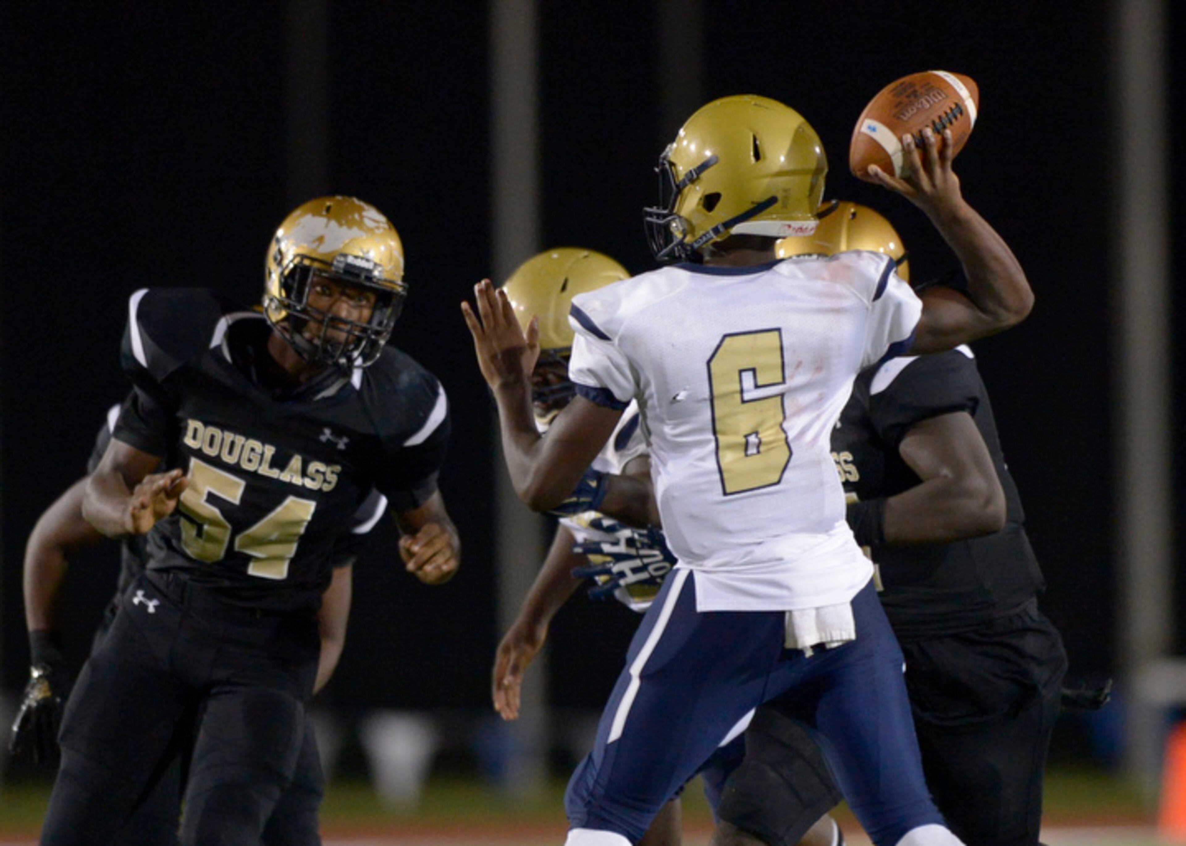 Hapeville Charter junior QB Jeremy Stephens (6) drops back for a pass in the second half of his game Friday, September 28, 2018 at Lakewood Stadium. PHOTO/Daniel Varnado