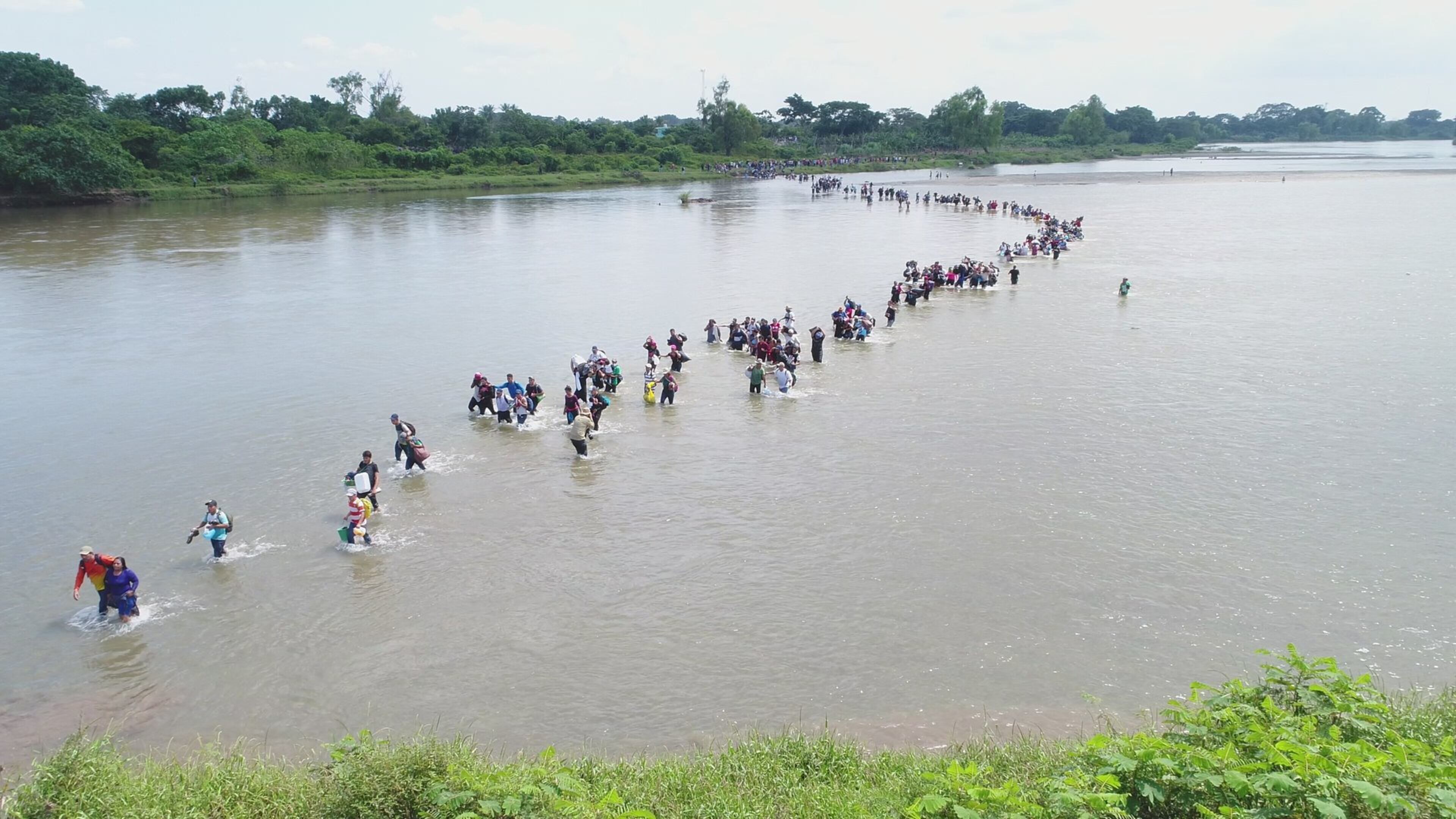Salvadoran migrants cross the border between Guatemala and Mexico in November, 2018. (AP Photo/Oscar Rivera)