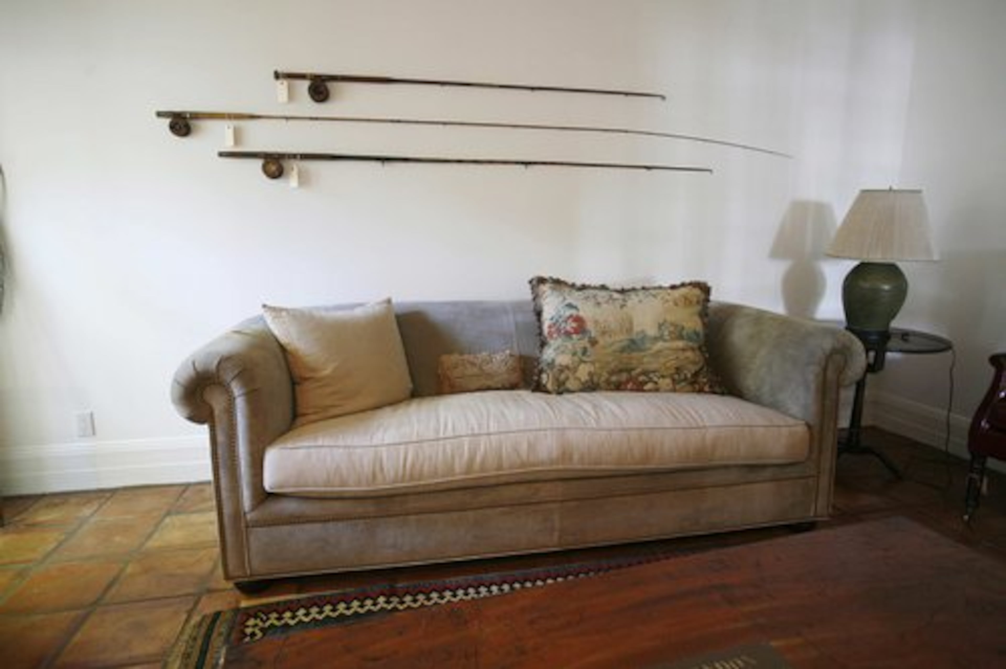 Fishing rods hang on the wall of Bernard Madoff's study in his Palm Beach, Fla. home Tuesday, Sept. 8, 2009. The house and its contents will be sold at auction.