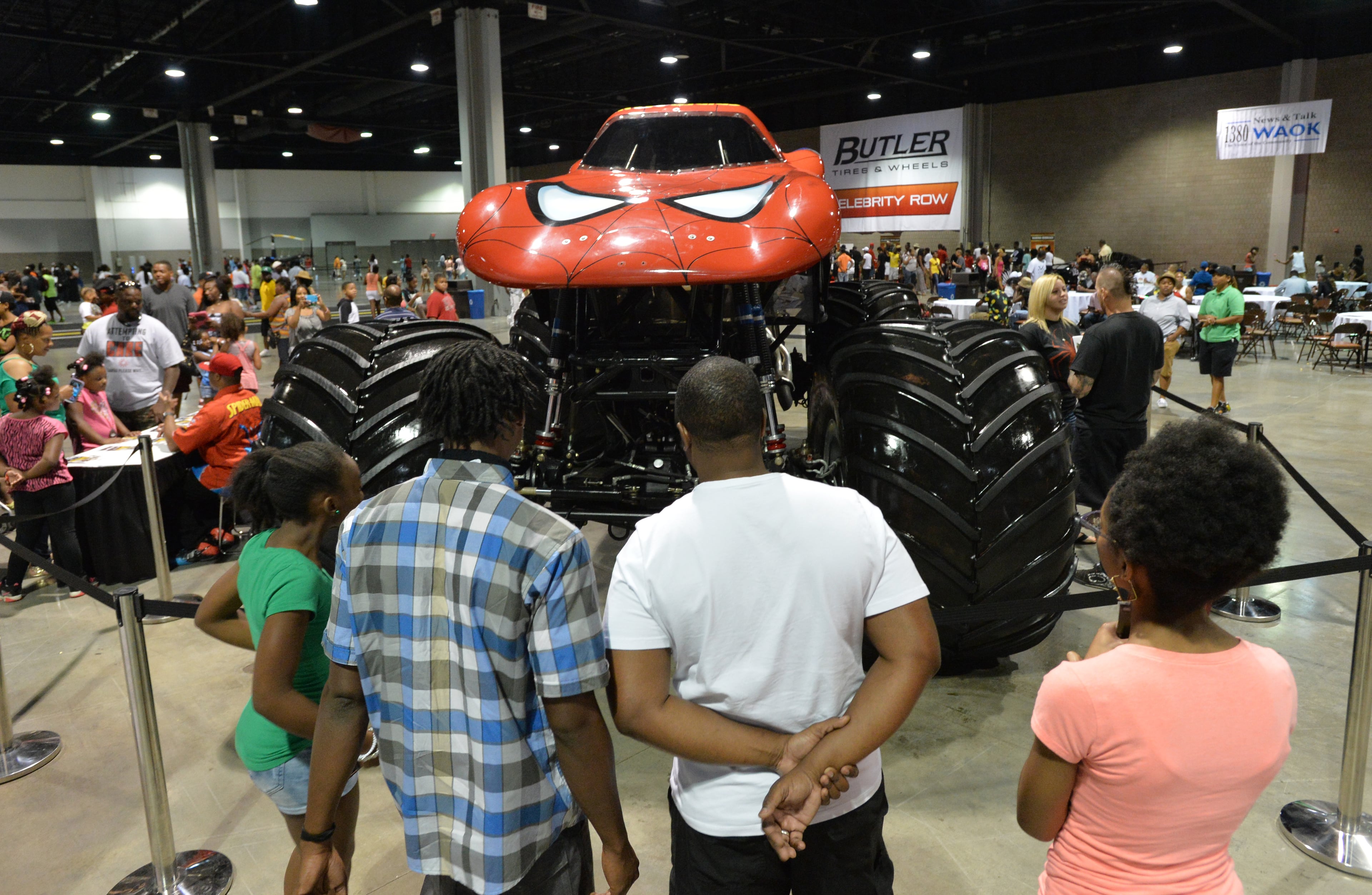 Event-goers watch Spider-Man Monster Truck during The 2014 V-103/WAOK Car & Bike Show at the Georgia World Congress Center on Saturday, July 12, 2014.
