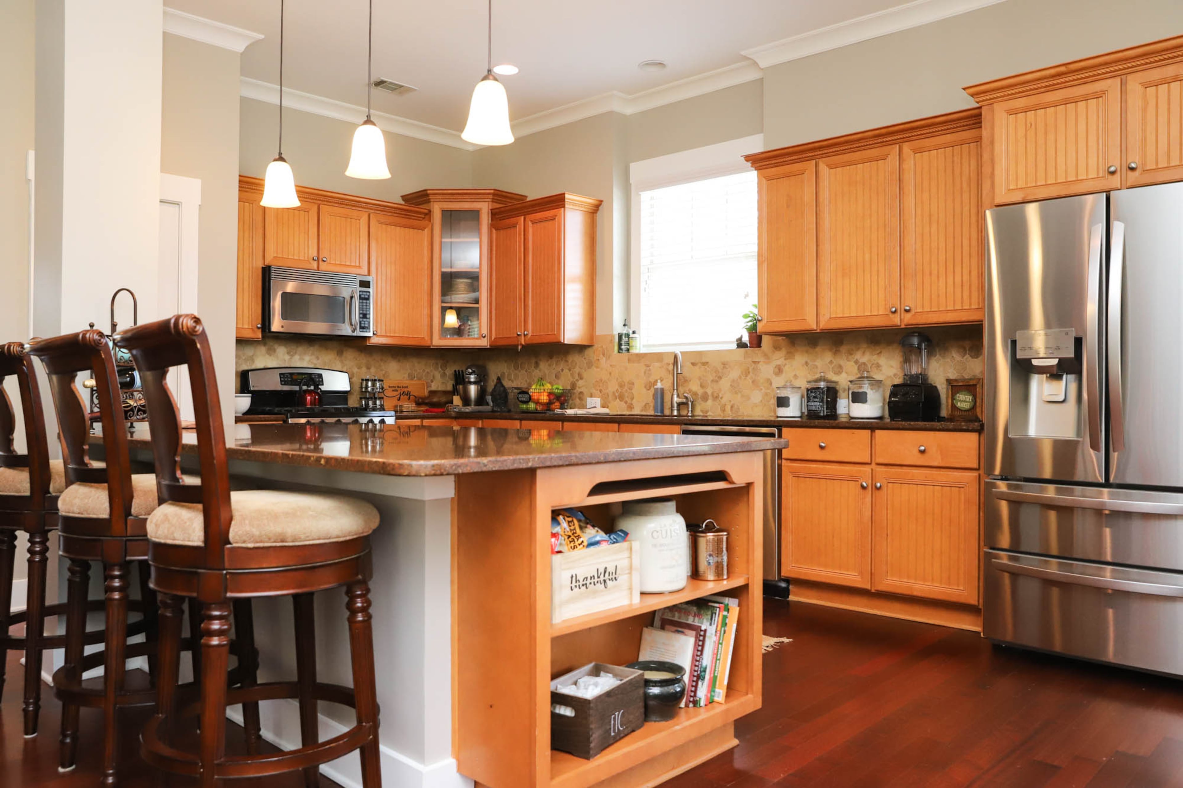 As someone who loves to entertain and have family gatherings in her home, Gail Burns-Grant loves her open concept living area. With the large island and bountiful counter space, the kitchen of Burns-Grant’s home is ideal for cooking and hosting guests simultaneously. Text by Shannon Dominy/Photo by Reynolds Rogers