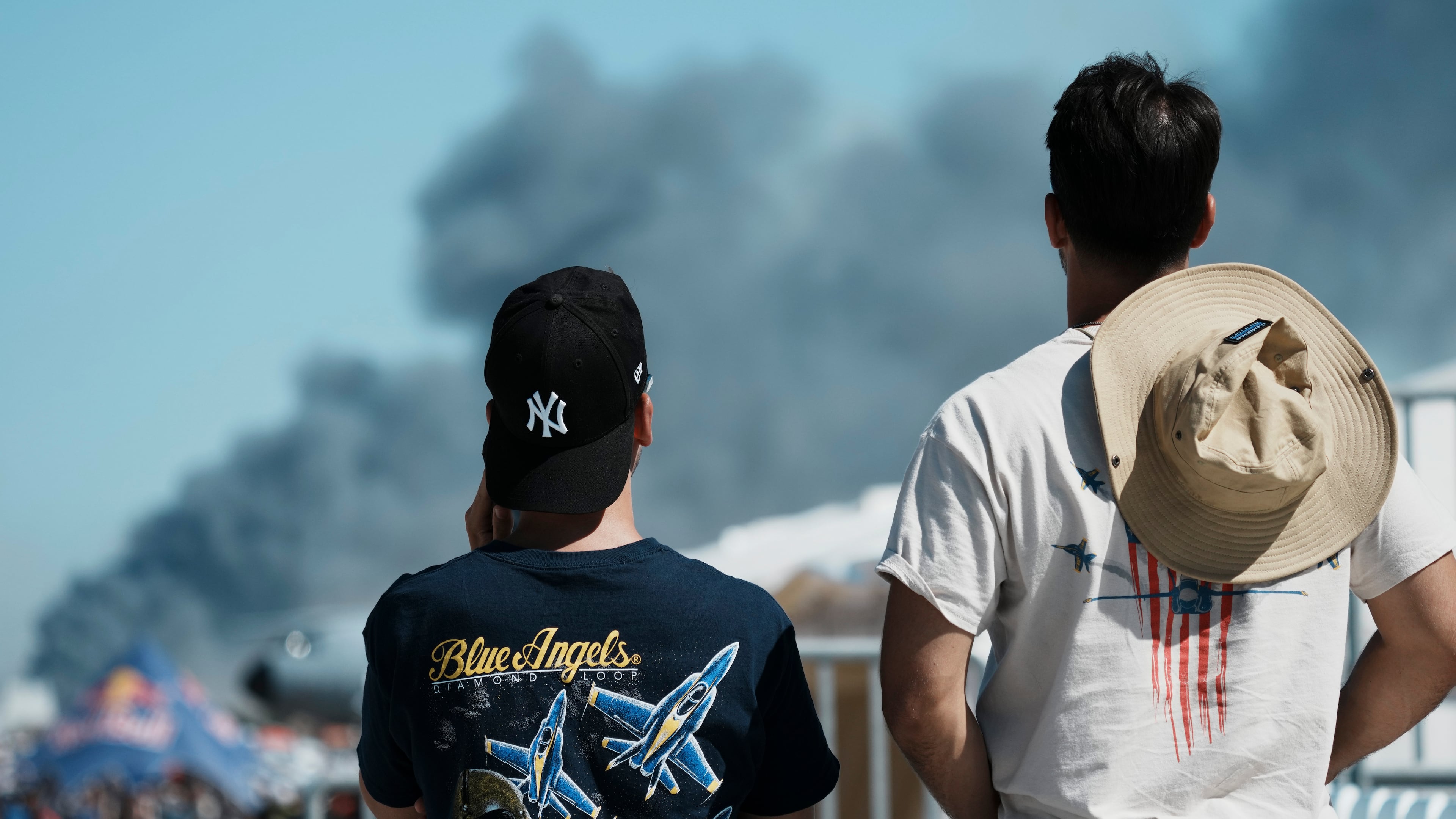 Spectators watch as smoke rises after a Hellenic Air Force F-4 Phantom fighter jet crashed, during the Athens Flying Week airshow at Tanagra Air Force Base, north of Athens, Greece, Saturday, Sept. 5, 2026. (AP Photo/Kallista Allaway)