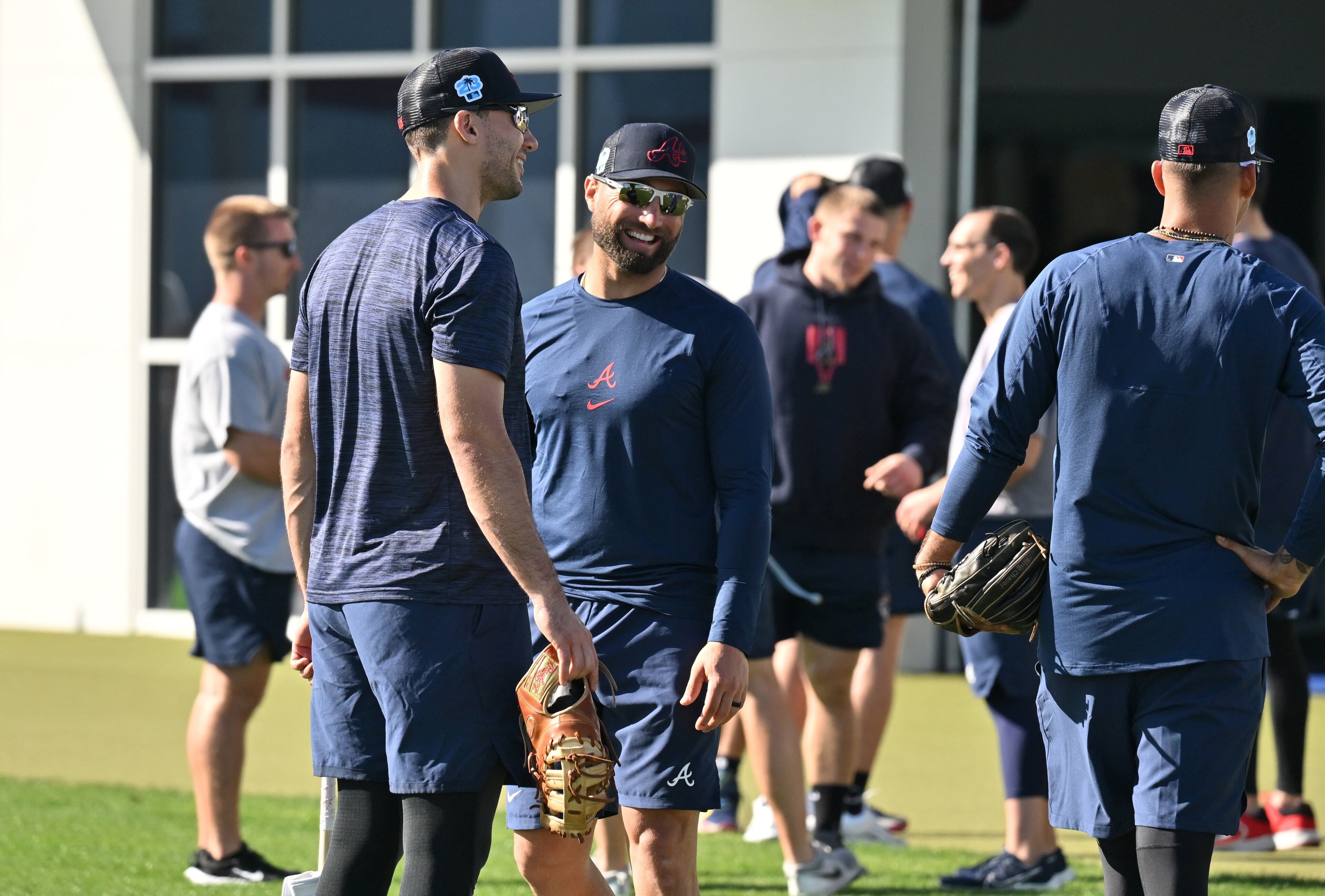 Braves outfielder Kevin Pillar smiles as he talks to first baseman Matt Olson during spring training Thursday at CoolToday Park in North Port, Florida. (Hyosub Shin / Hyosub.Shin@ajc.com)