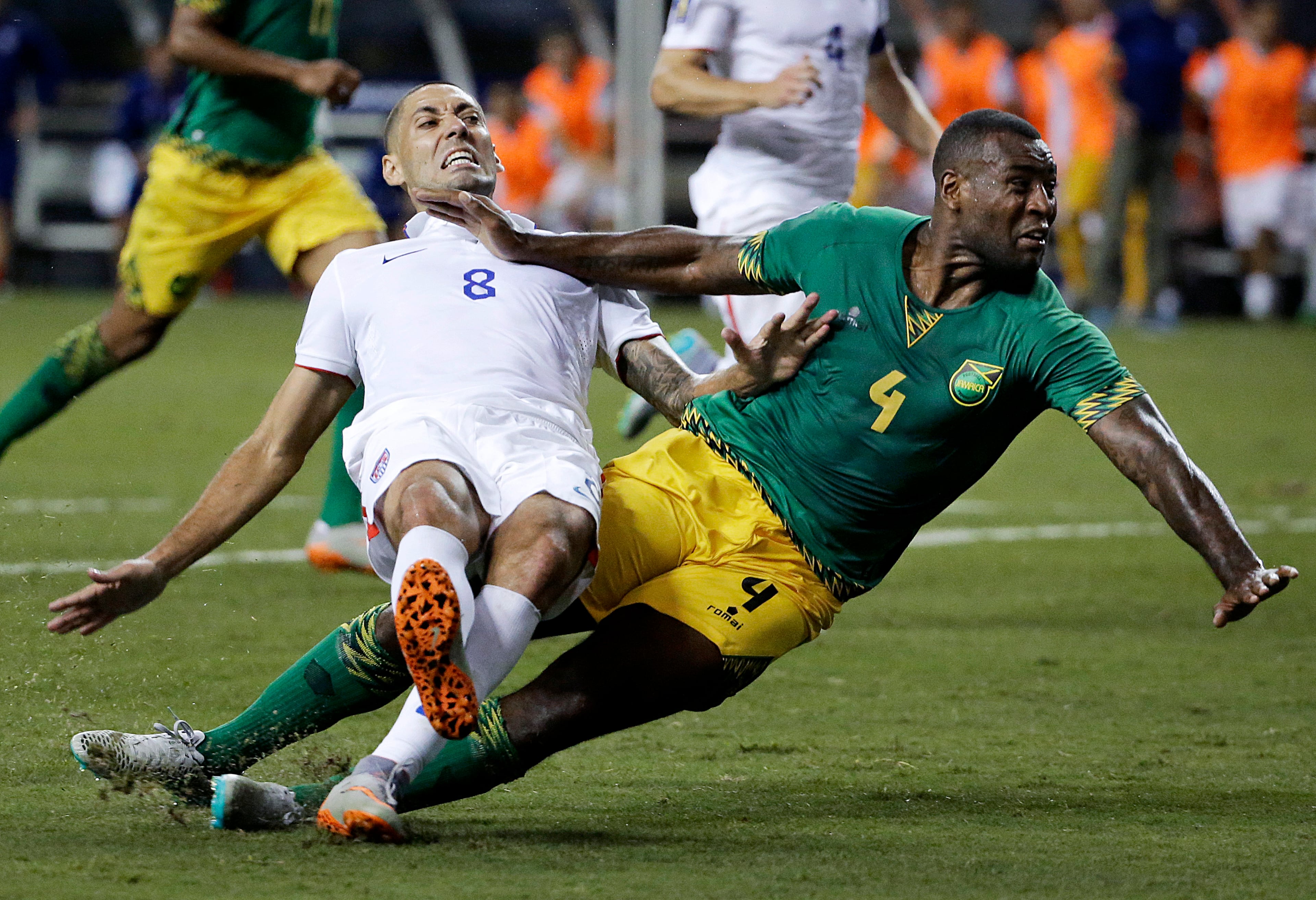United States' Clint Dempsey, left, collides with Jamaica's Wes Morgan during the second half of a CONCACAF Gold Cup soccer semifinal, Wednesday, July 22, 2015, in Atlanta. Jamaica won 2-1. (AP Photo/David Goldman)
