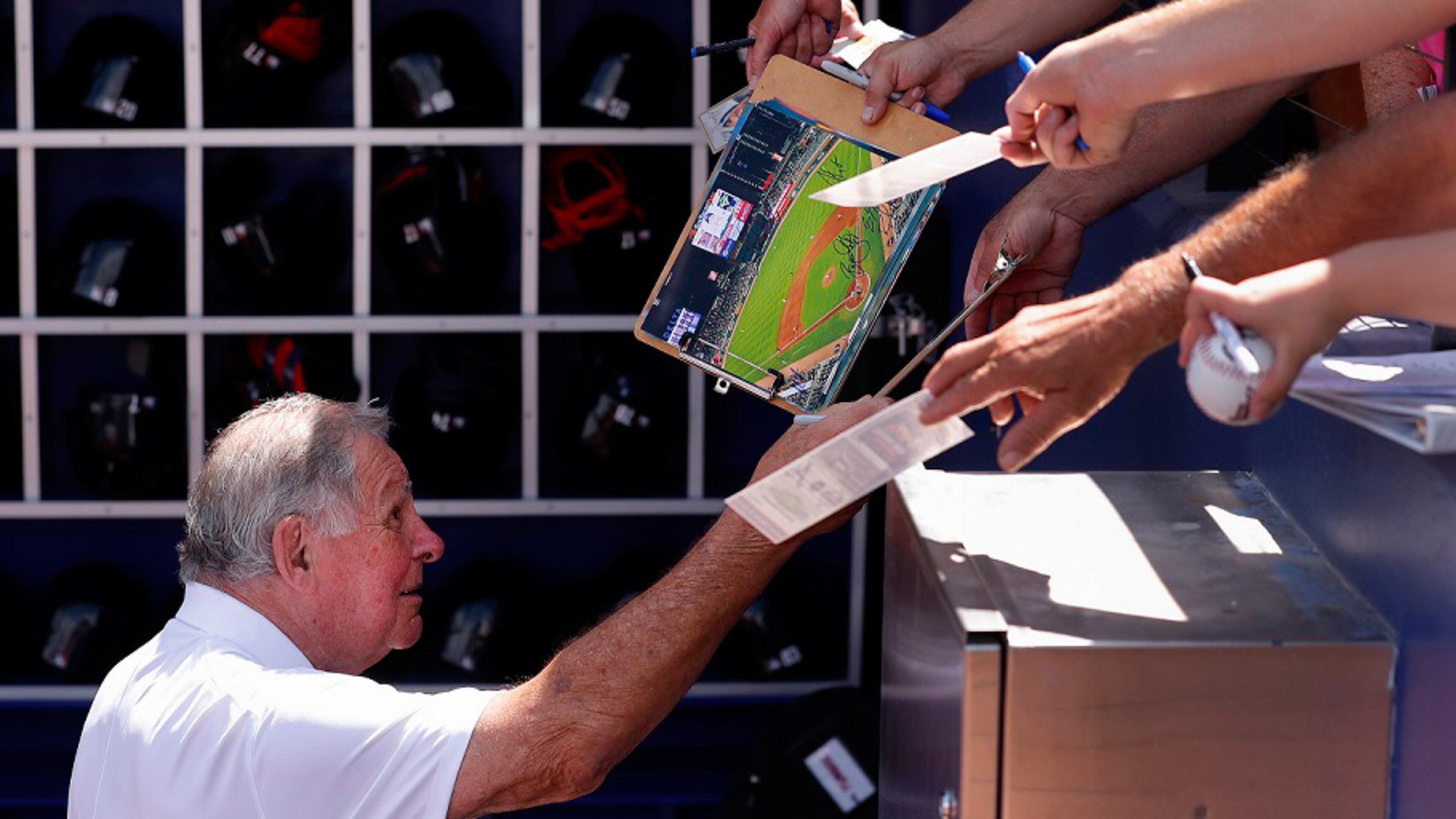 Former Atlanta Braves manager and Baseball Hall of Fame member Bobby Cox gives autographs before a spring training baseball game between the Braves and the Tampa Bay Rays, Sunday, March 24, 2019, at CoolToday Park in North Port, Fla. (AP Photo/John Bazemore)
