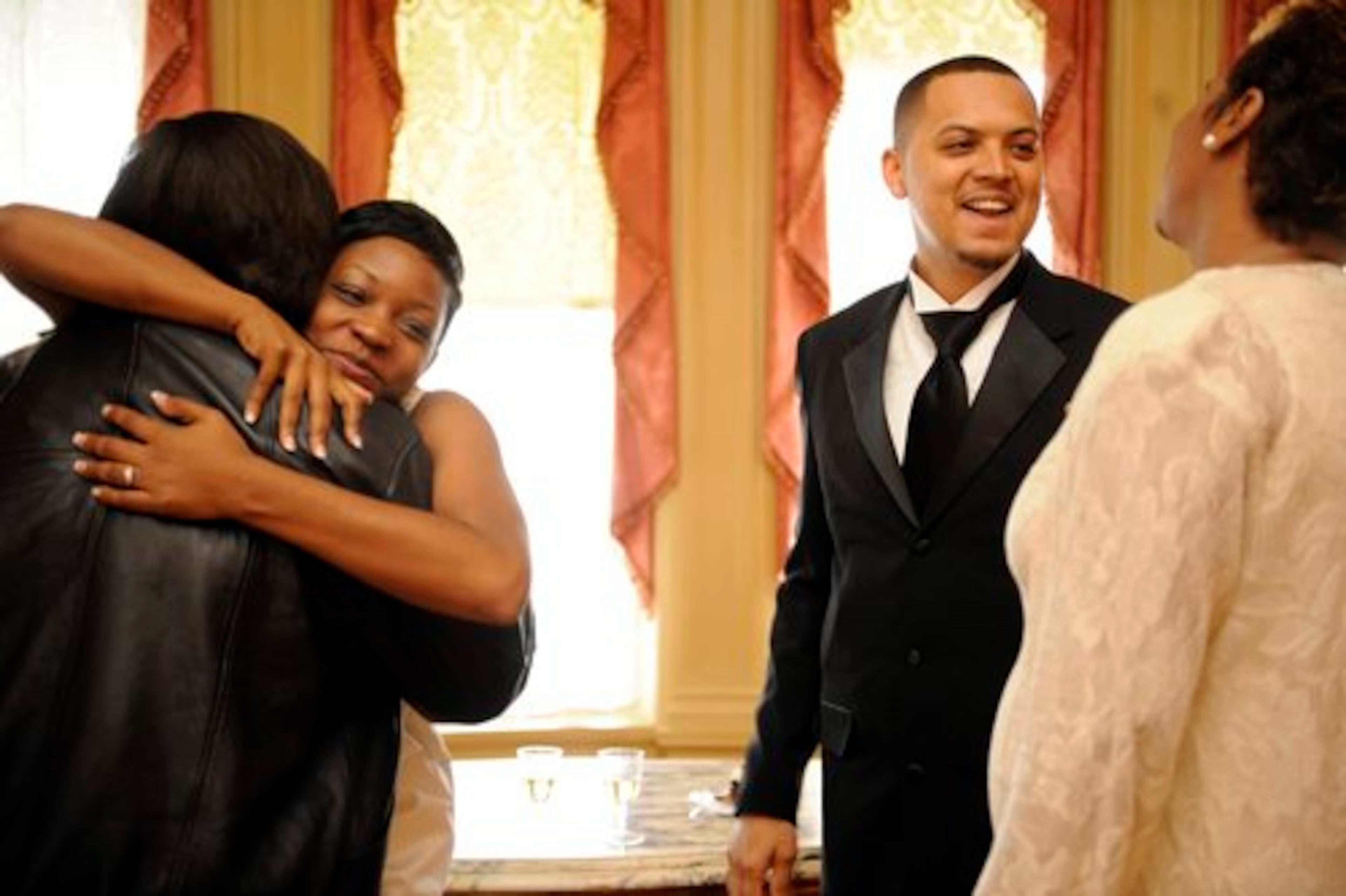 Newlyweds Ashley Lammie and Clarence Lammie visit with family after the nuptials.