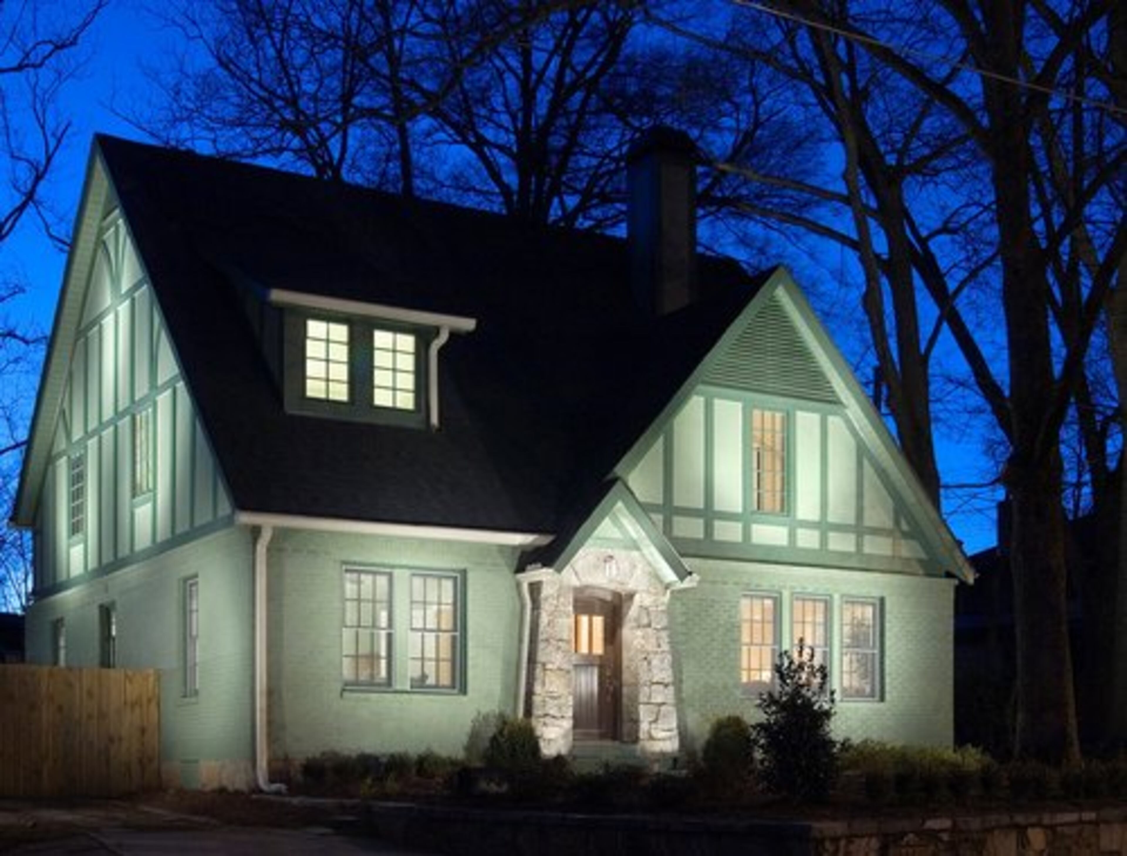 AFTER: Original color choice, a charming dormer window, custom front door, a modest scale and a welcoming facade all make for the golden ticket of curb appeal in this award-winning Decatur renovation.