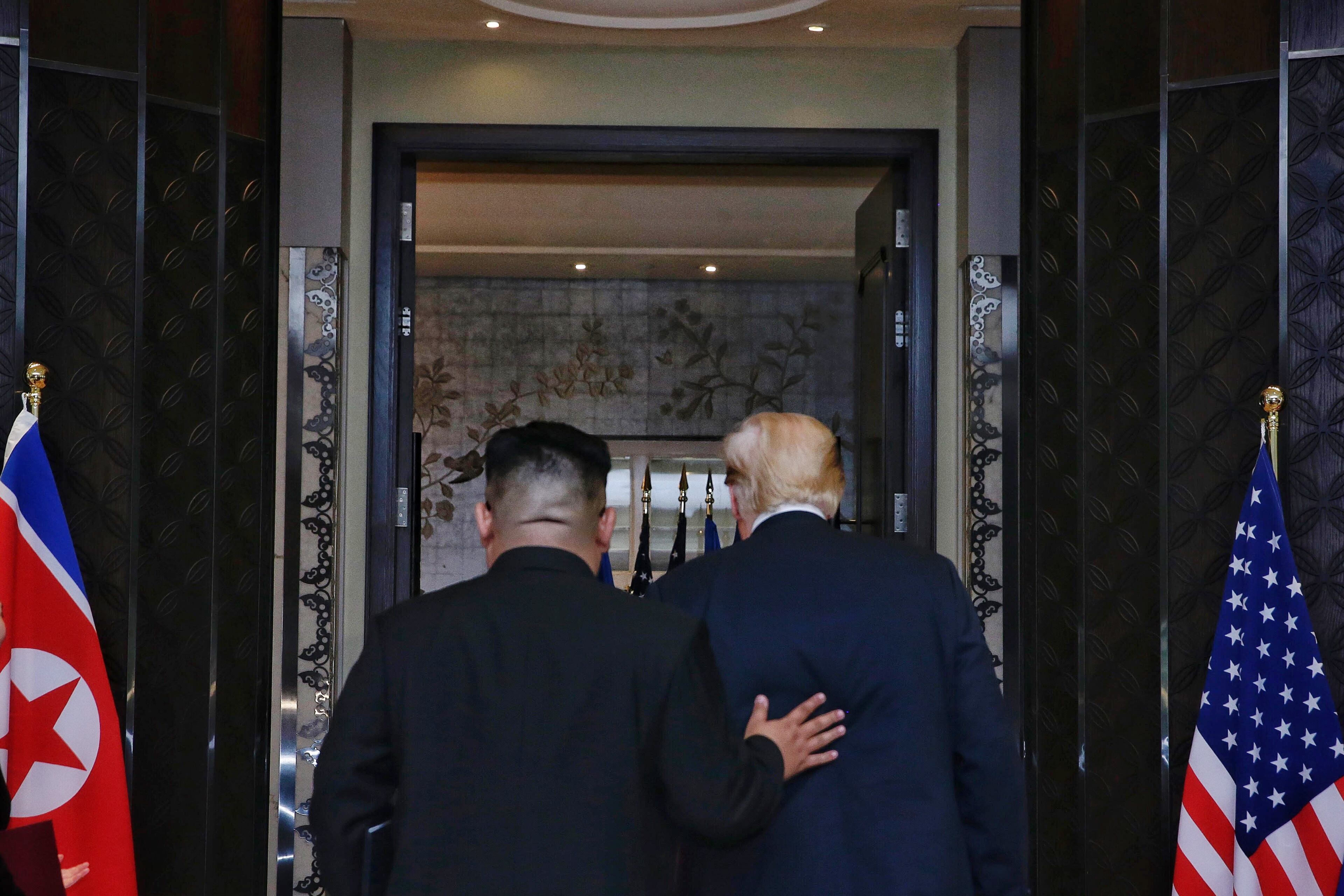 SINGAPORE, SINGAPORE - JUNE 12: In this handout photograph provided by The Strait Times, North Korean leader Kim Jong-un (L) with U.S. President Donald Trump (R) during their historic U.S.-DPRK summit at the Capella Hotel on Sentosa island on June 12, 2018 in Singapore. U.S. President Trump and North Korean leader Kim Jong-un held the historic meeting between leaders of both countries on Tuesday morning in Singapore, carrying hopes to end decades of hostility and the threat of North Korea's nuclear programme. (Photo by Kevin Lim/The Strait Times/Handout/Getty Images)