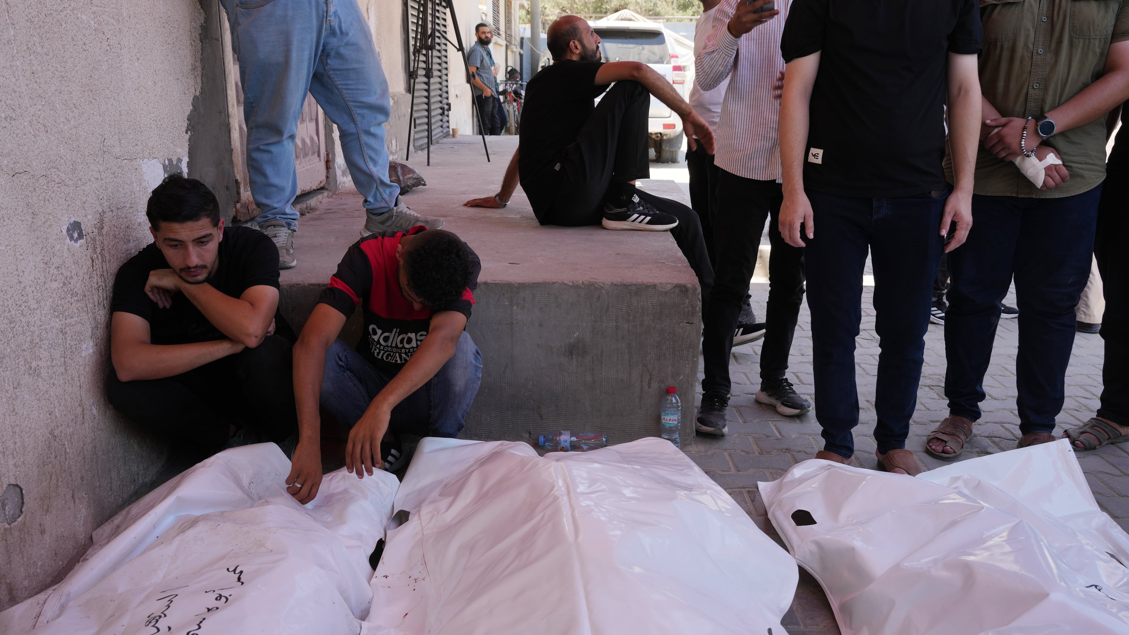 Palestinians mourn the bodies of people killed in an Israeli military strike on a residential building during their funeral at Al-Aqsa Hospital in Deir al-Balah, central Gaza Strip, Wednesday, July 15, 2026. (AP Photo/Abdel Kareem Hana)