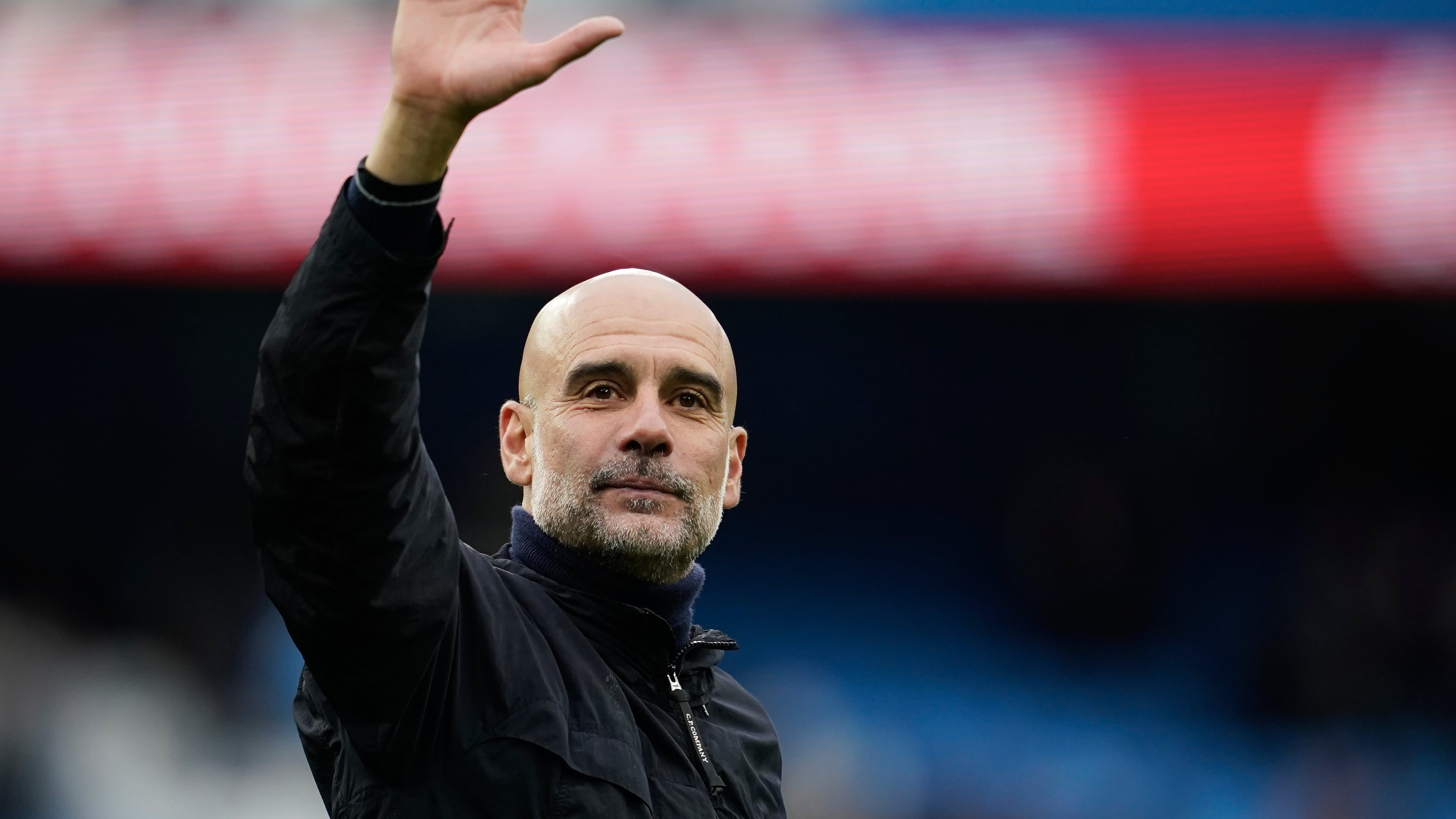 FILE - Manchester City's head coach Pep Guardiola greets fans at the end of the English Premier League soccer match between Manchester City and Brentford in Manchester, Saturday, May 9, 2026. (AP Photo/Dave Thompson, File)