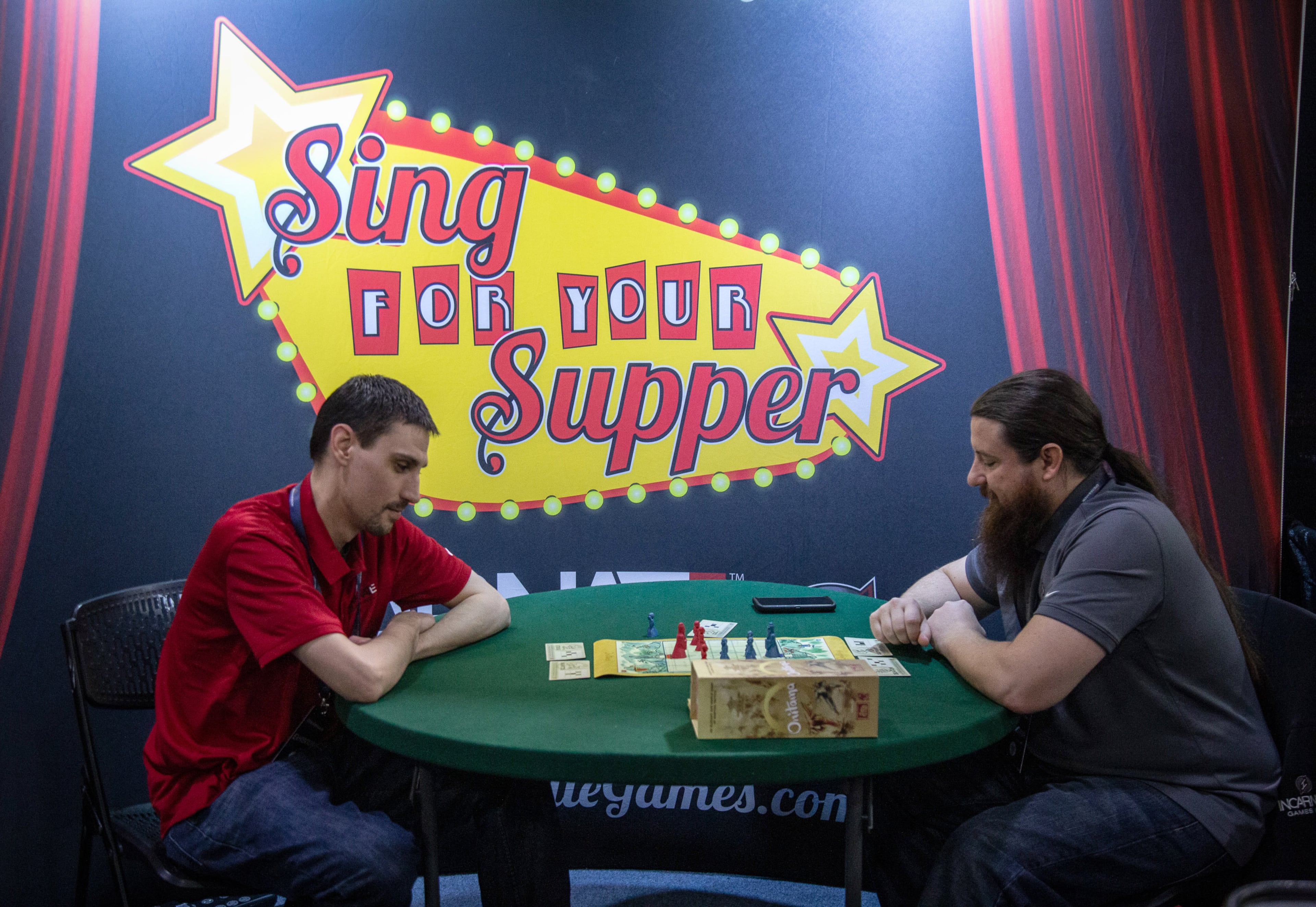 Adam Grinstead (L) and Jason Allen play a game while waiting for customers during DreamHack Atlanta at the Georgia World Congress Center Sunday, November 17, 2019. STEVE SCHAEFER / SPECIAL TO THE AJC