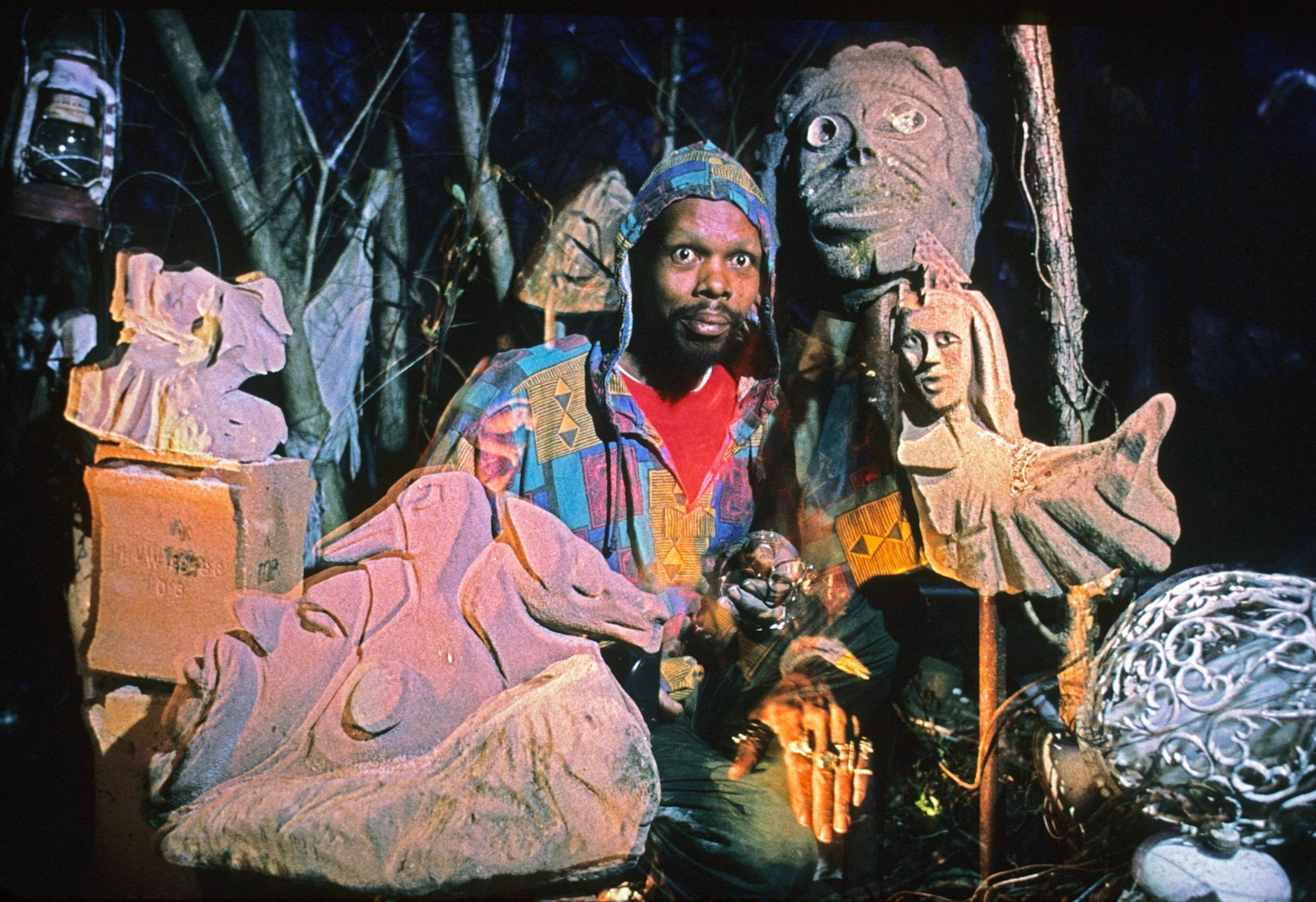 Holley with some of his outdoor sculptural creations from recycled materials. “Everything I do is an offering to the spirits,” says the artist.