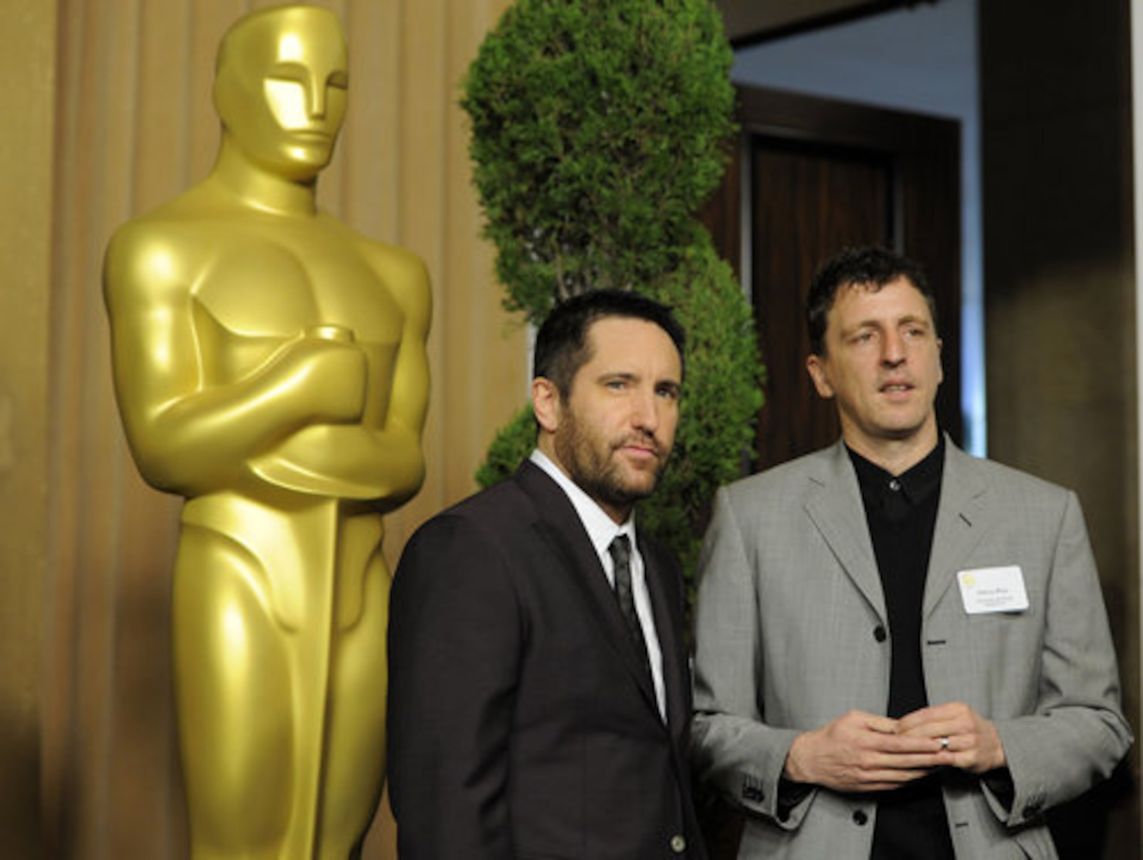 Trent Reznor, left, and Atticus Ross, Oscar nominees for Original Score for "The Social Network," arrive at the 30th Academy Awards Nominees Luncheon in Beverly Hills, Calif.