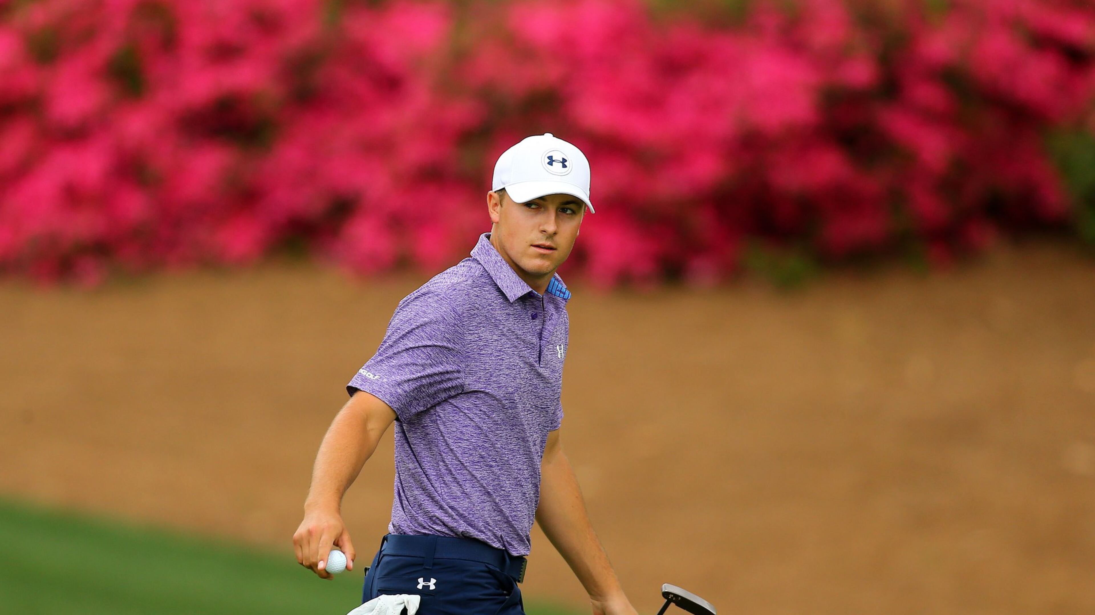 Jordan Spieth goes to 12-under at No. 10 after a 18-foot putt for birdie in the second round at Augusta National Golf Club on Friday, April 10, 2015. (CURTIS COMPTON/CCOMPTON@AJC.COM)