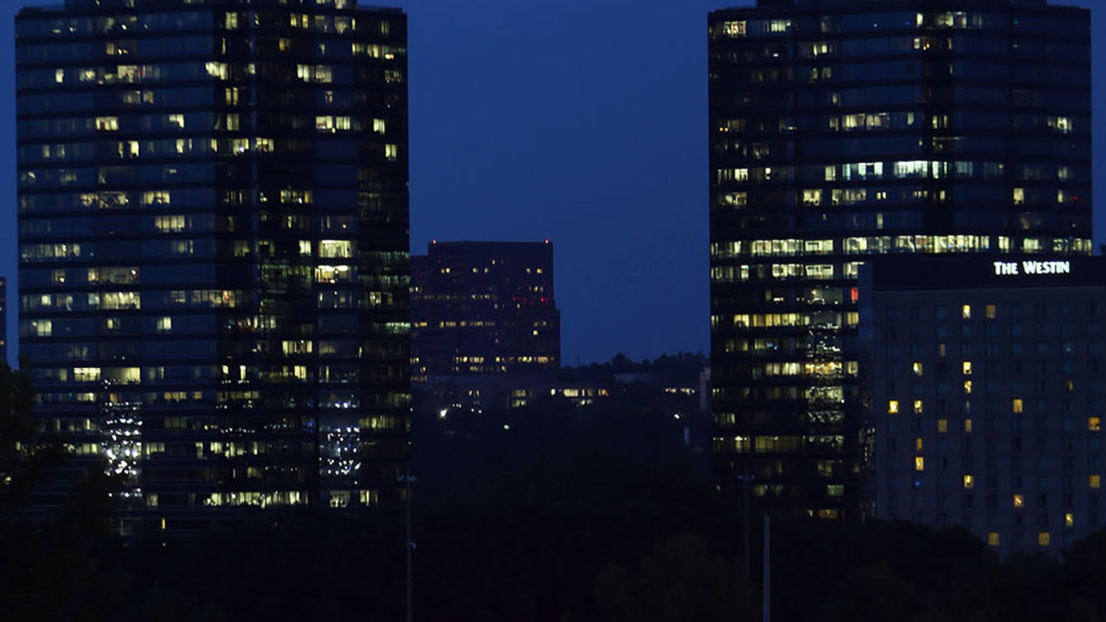 The crown of the Queen building of the Concourse Corporate Center in Sandy Springs is illuminated in pink lighting for the month of October in recognition of National Breast Cancer Awareness Month.