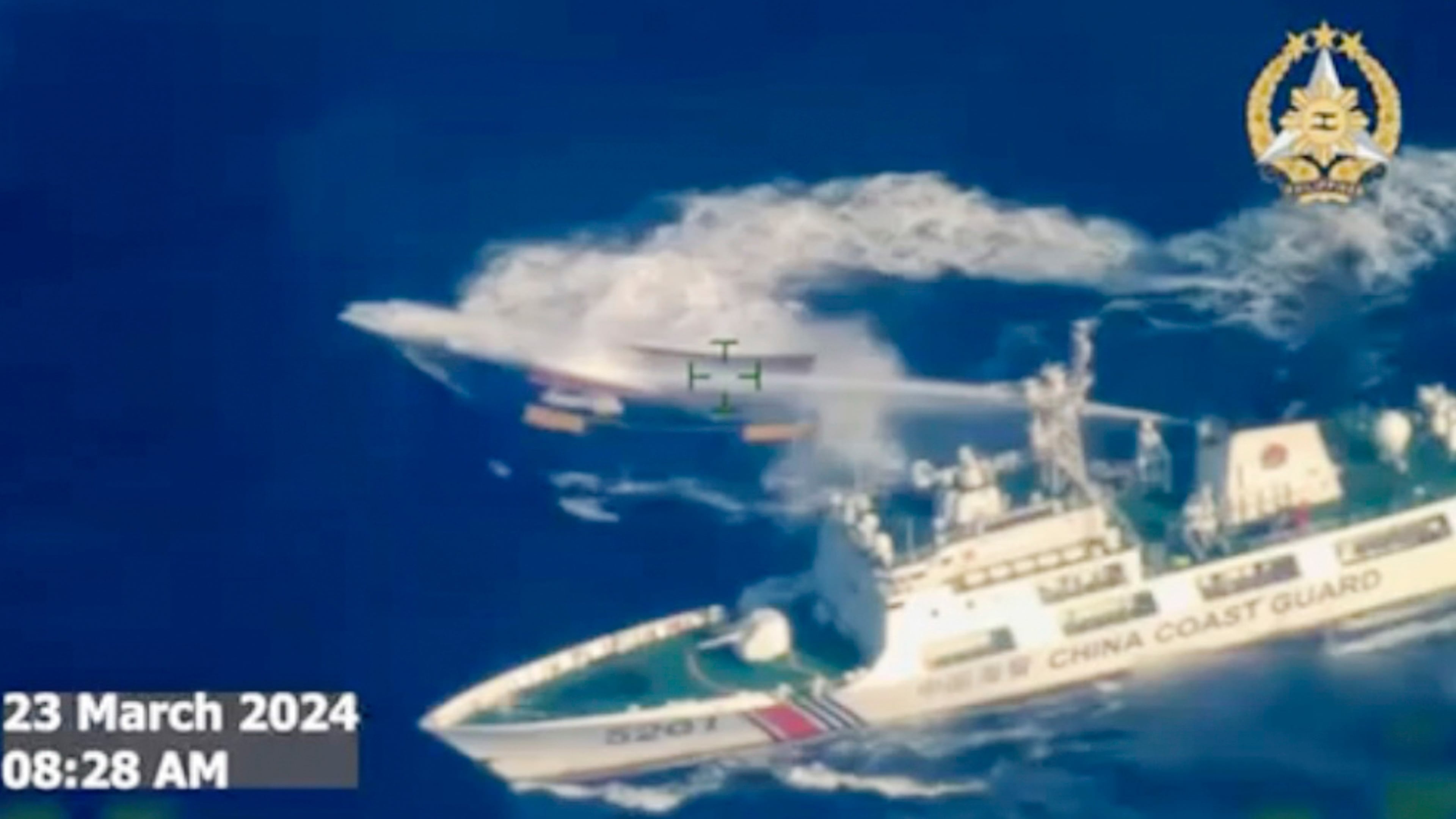 FILE - In this image made from video provided by the Armed Forces of the Philippines, a Chinese coast guard ship uses water cannon on a Philippine resupply vessel Unaizah May 4 as it approaches Second Thomas Shoal, locally called Ayungin shoal, at the disputed South China Sea on March 23, 2024. (Armed Forces of the Philippines via AP, File)
