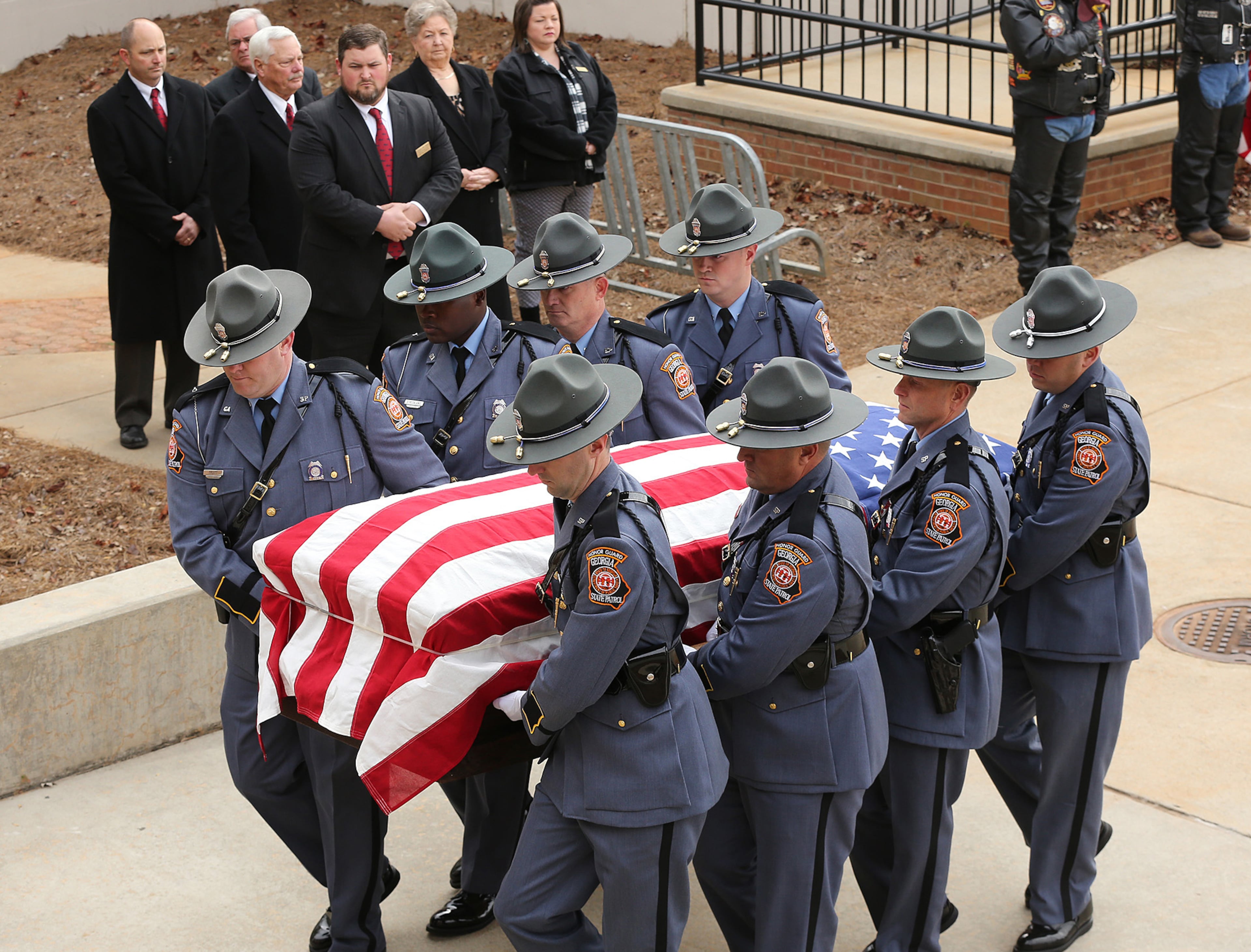 December 11, 2016, AMERICAS: Americus police officer Nicholas Ryan Smarr arrives by honor guard to his funeral service at the Georgia Southwestern State University Storm Dome on Sunday, Dec. 11, 2016, in Americas. Officer Smarr and Georgia Southwestern State University campus police officer Jody Smith were killed responding to a domestic dispute. Curtis Compton/ccompton@ajc.com