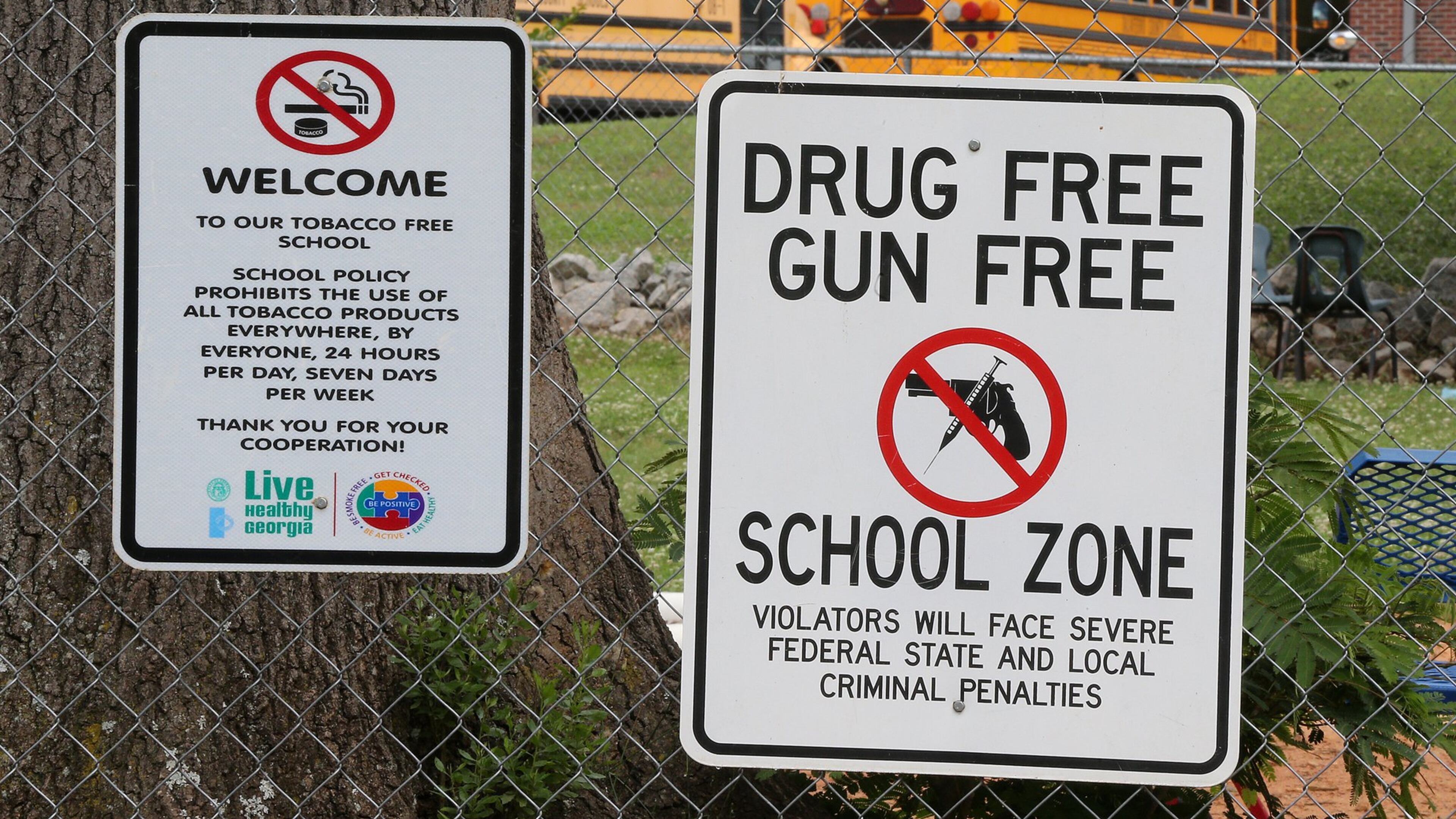 Signs hang on the fence around the Taliaferro County school complex on Wednesday, May 23, 2018, in Crawfordville. Taliaferro County is the state’s smallest school district. Curtis Compton/ccompton@ajc.com