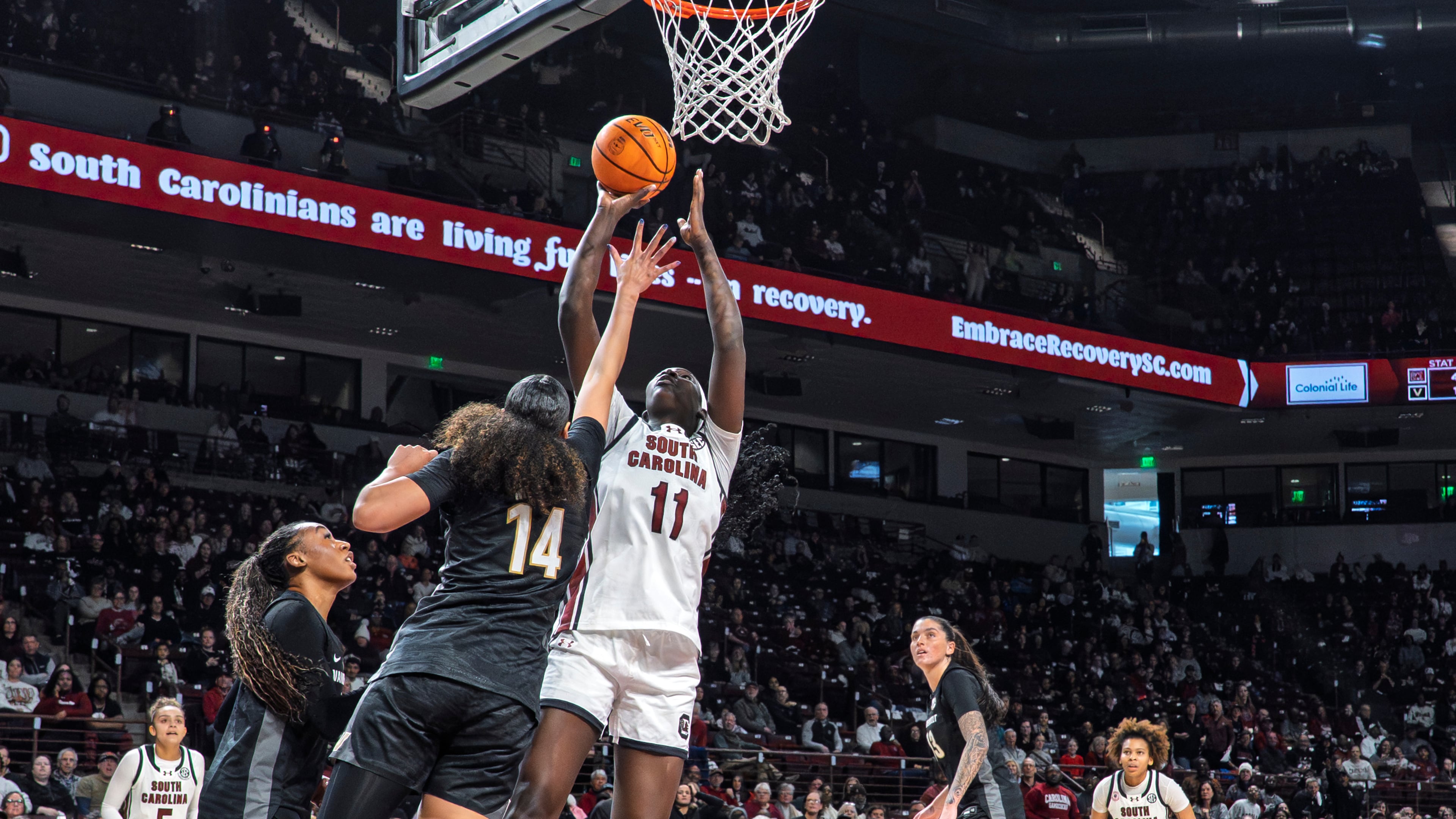 South Carolina center Madina Okot (11) shoots the ball over Vanderbilt forward Aiyana Mitchell (14) during the first half of an NCAA college basketball game Sunday, Jan. 25, 2026, in Columbia, S.C. (AP Photo/David Yeazell)