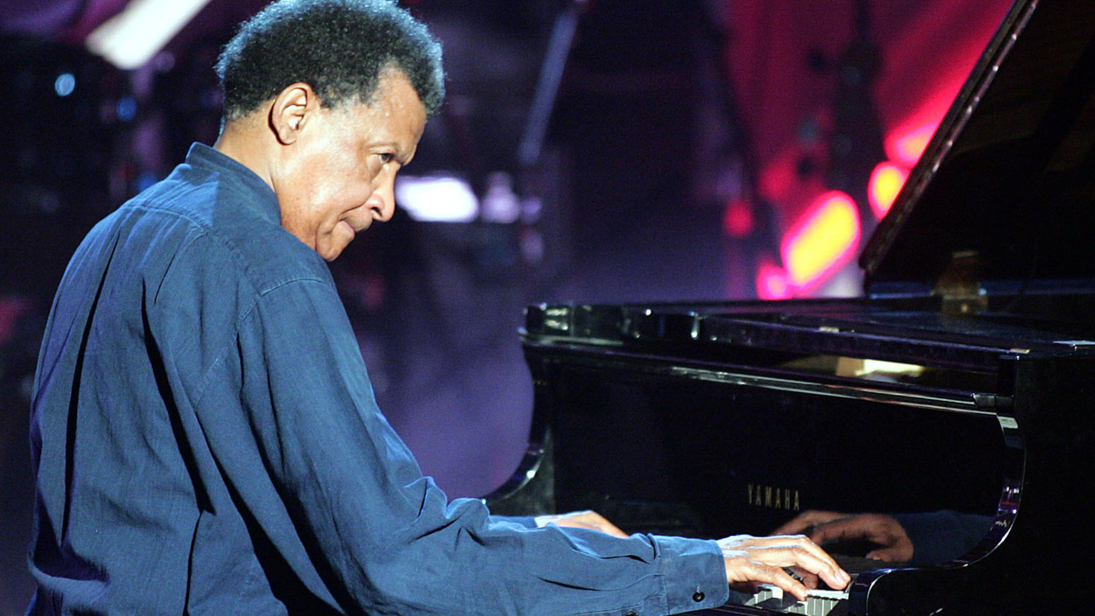FILE - Musician Abdullah Ibrahim plays on a grand piano during the Adolf-Grimme awards gala in Marl, western Germany, March 18, 2005. (AP Photo/Martin Meissner, File)