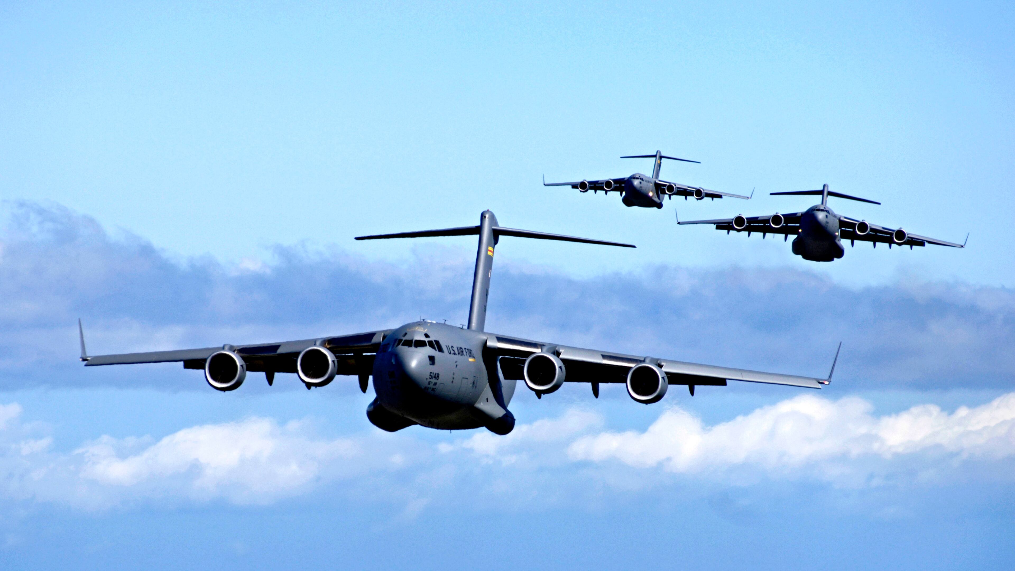This image provided by the US Air Force shows C-17 Globemasters from the 535th Airlift Squadron, Hickam Air Force Base, Hawaii participating in an airdrop training mission May 16, 2006. Workers at Boeing Co.’s sprawling Long Beach aircraft plant are expecting bad news Friday Aug. 18, 2006 about the fate of the C-17 cargo plane _ and their jobs. The company is expected to tell subcontractors to stop producing parts and supplies for the massive cargo plane because Congress has not funded enough orders to keep the line going past 2008. (AP Photo/US Air Force - Tech. Sgt. Shane A. Cuomo)