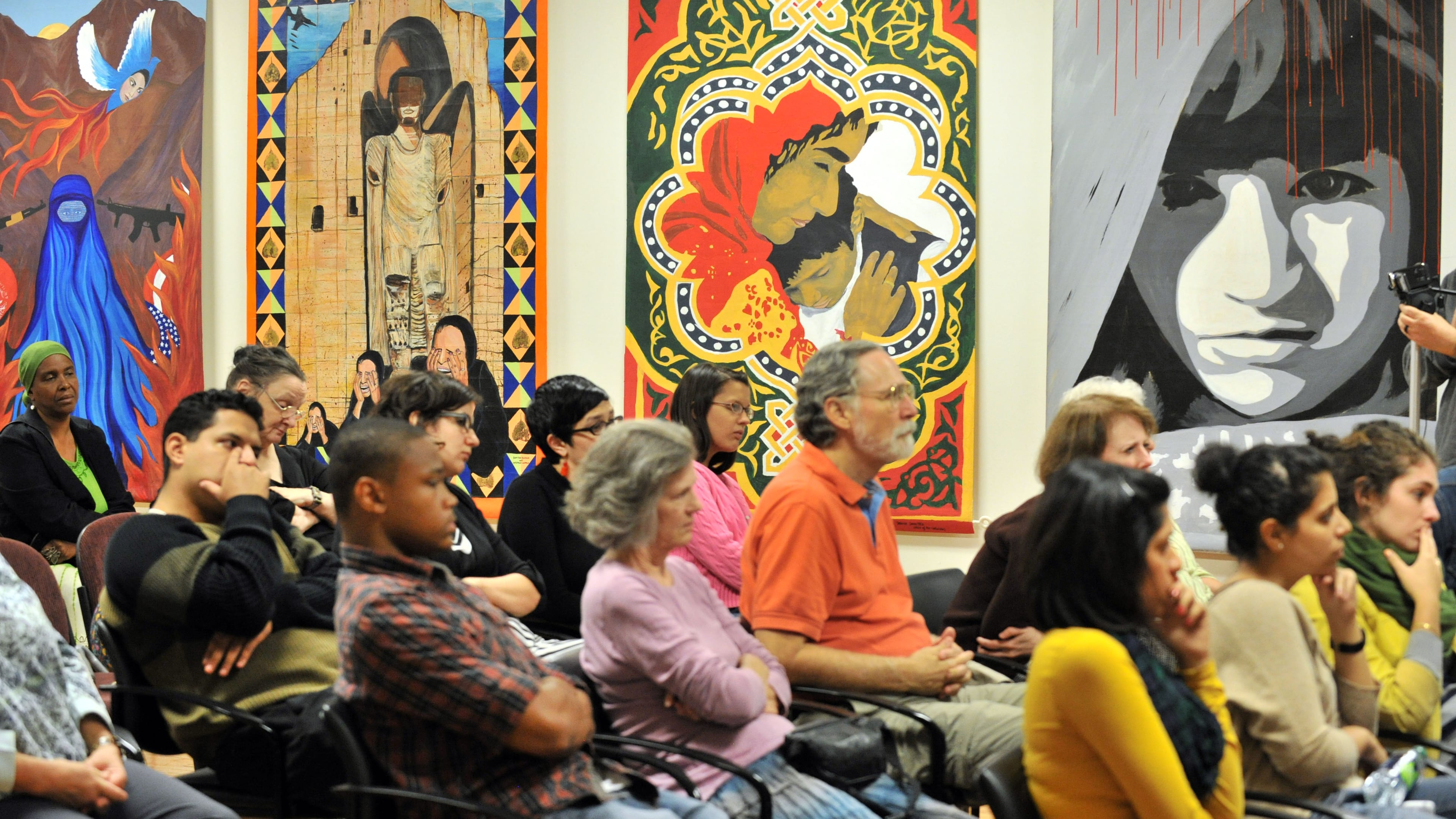 The audience listens to speakers during “Islamophobia: Voices from the Frontlines” at the Georgia Peace Center on Wednesday, Sept. 7, 2011, in Atlanta. (Hyosub Shin/AJC)
